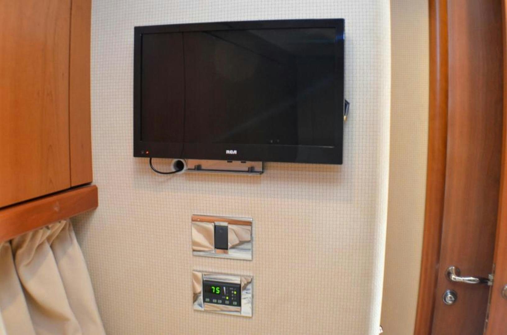 a tv on a wall aboard PEARL Yacht for Sale