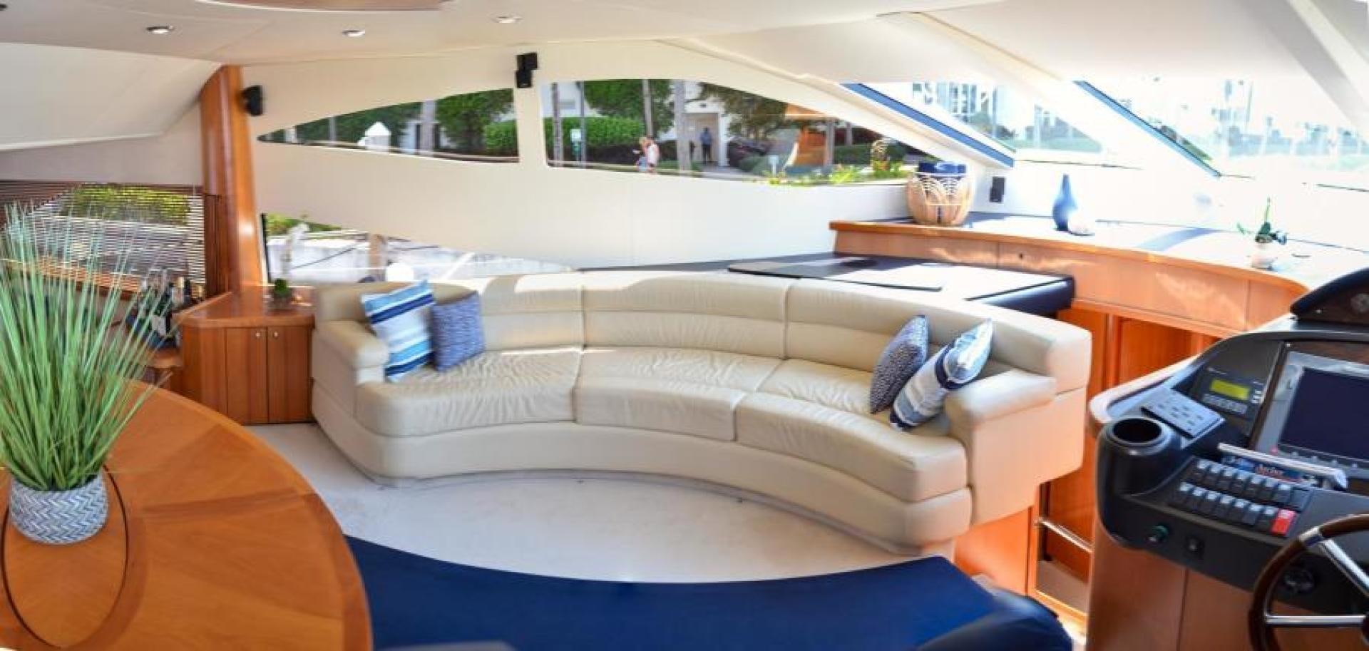 a living room with a couch and a laptop aboard PEARL Yacht for Sale