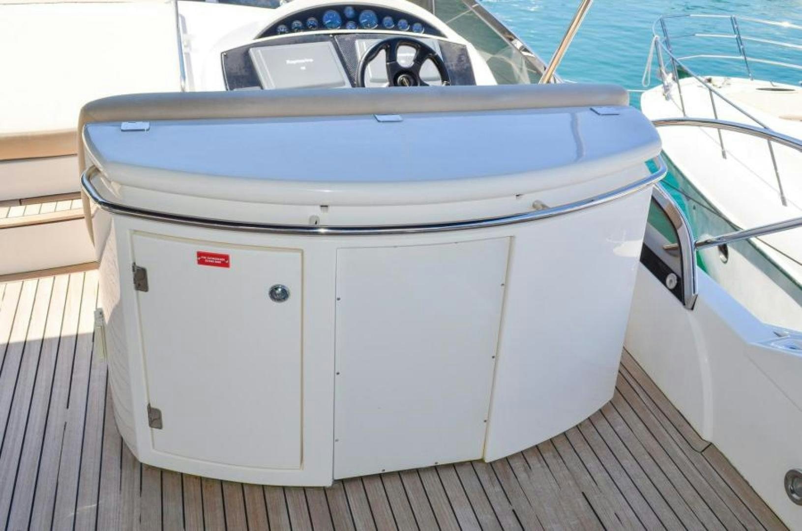 a white rectangular object on a wooden surface aboard PEARL Yacht for Sale