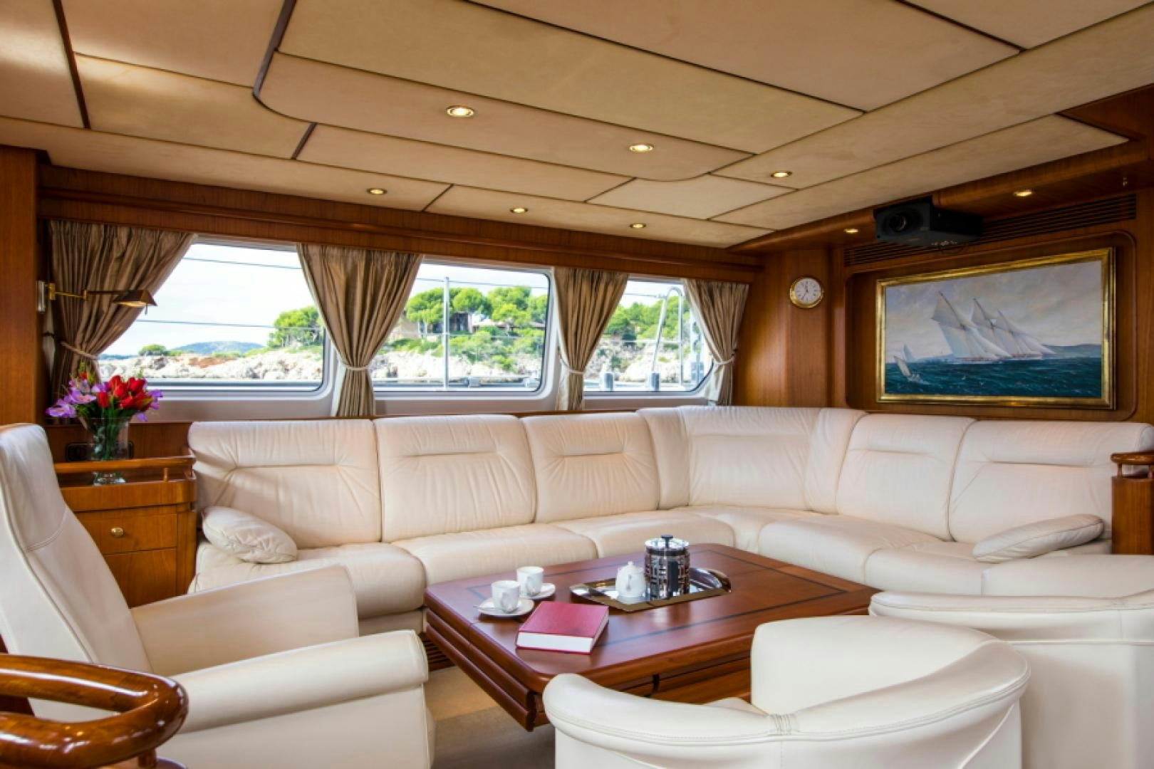 a living room with a large window aboard FIDELITAS Yacht for Sale