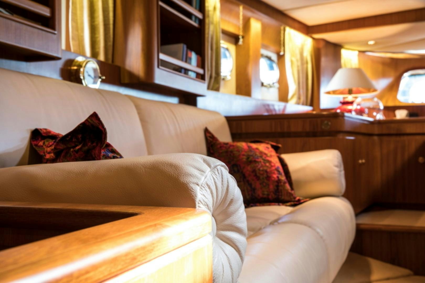 a couch with pillows aboard FIDELITAS Yacht for Sale