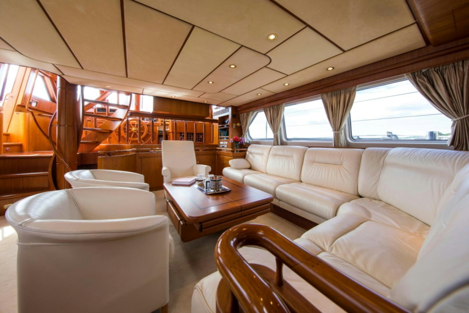 a room with a couch and a table aboard FIDELITAS Yacht for Sale