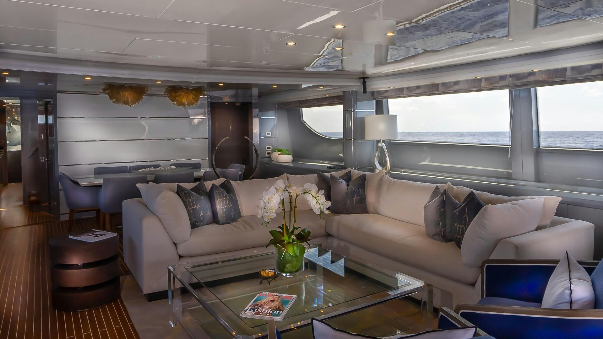 a living room with a couch and a coffee table aboard BAD ROMANCE IV Yacht for Sale