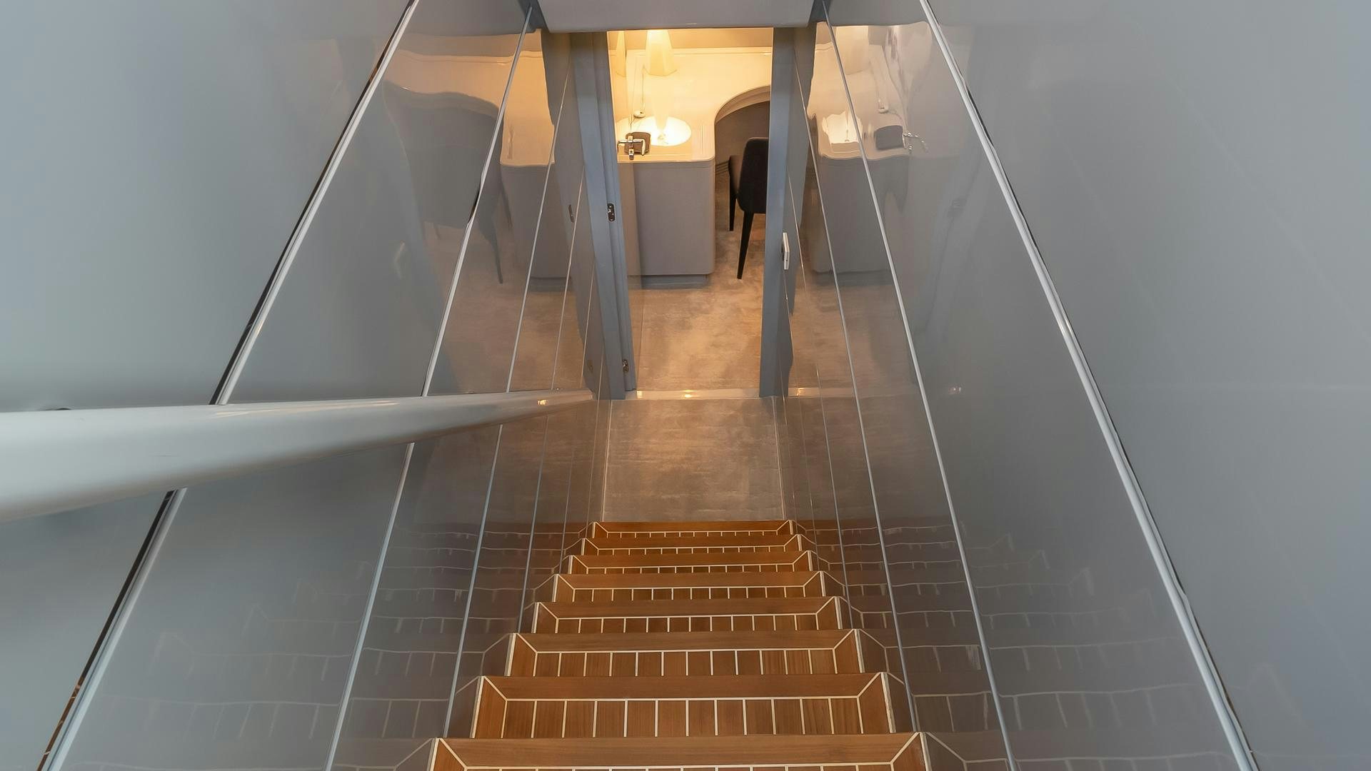 a hallway with a set of stairs aboard BAD ROMANCE IV Yacht for Sale