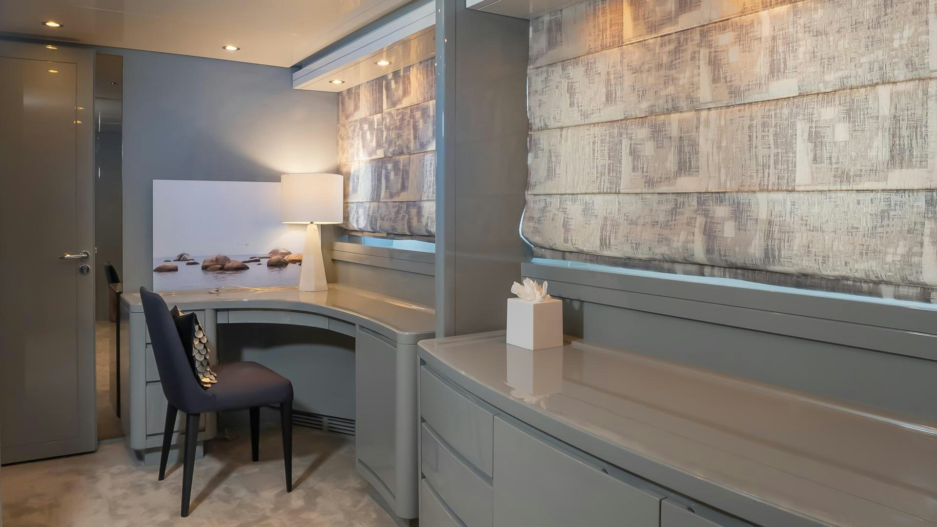 a room with a desk and a chair aboard BAD ROMANCE IV Yacht for Sale