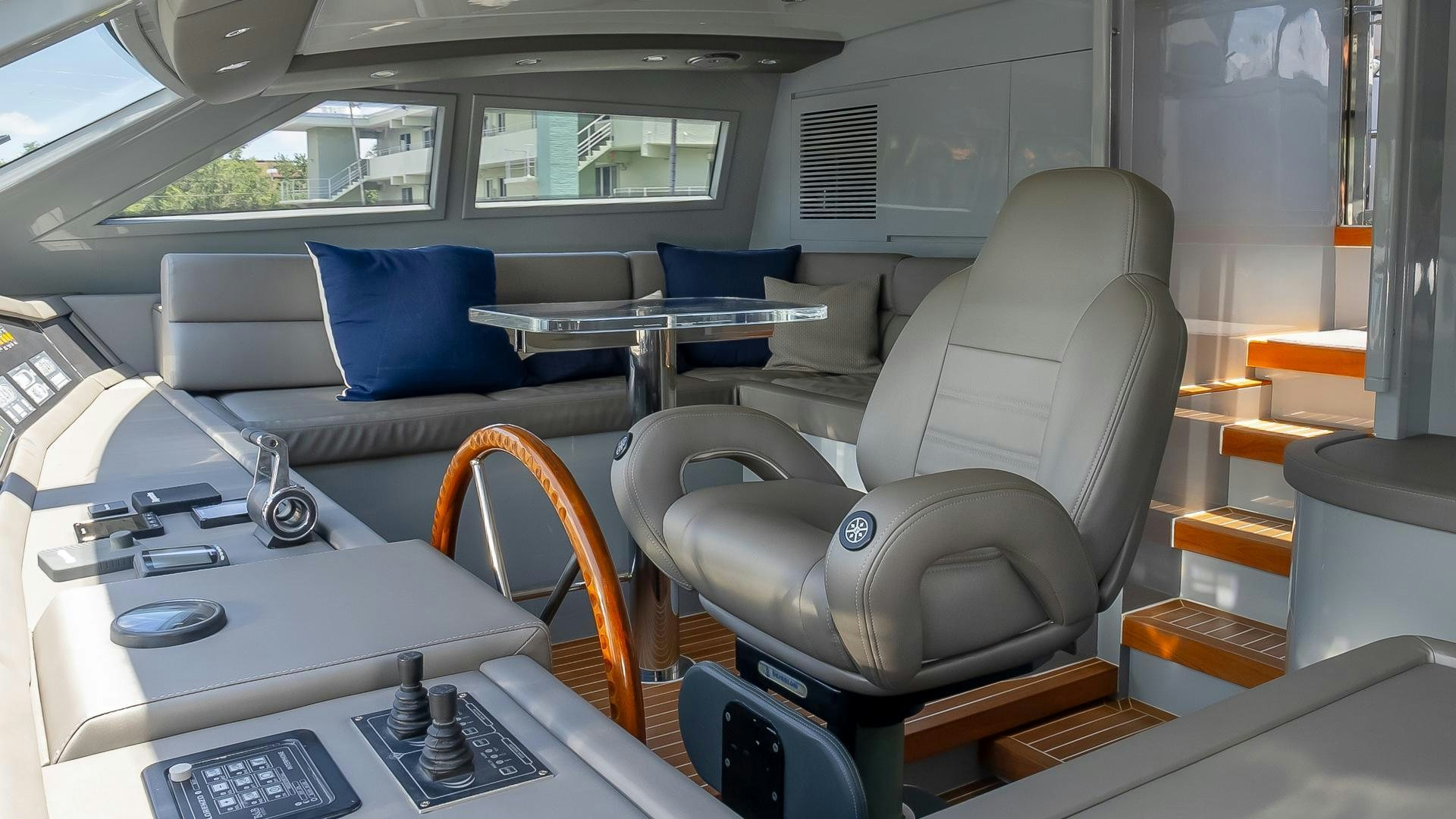 a room with a couch and a table aboard BAD ROMANCE IV Yacht for Sale