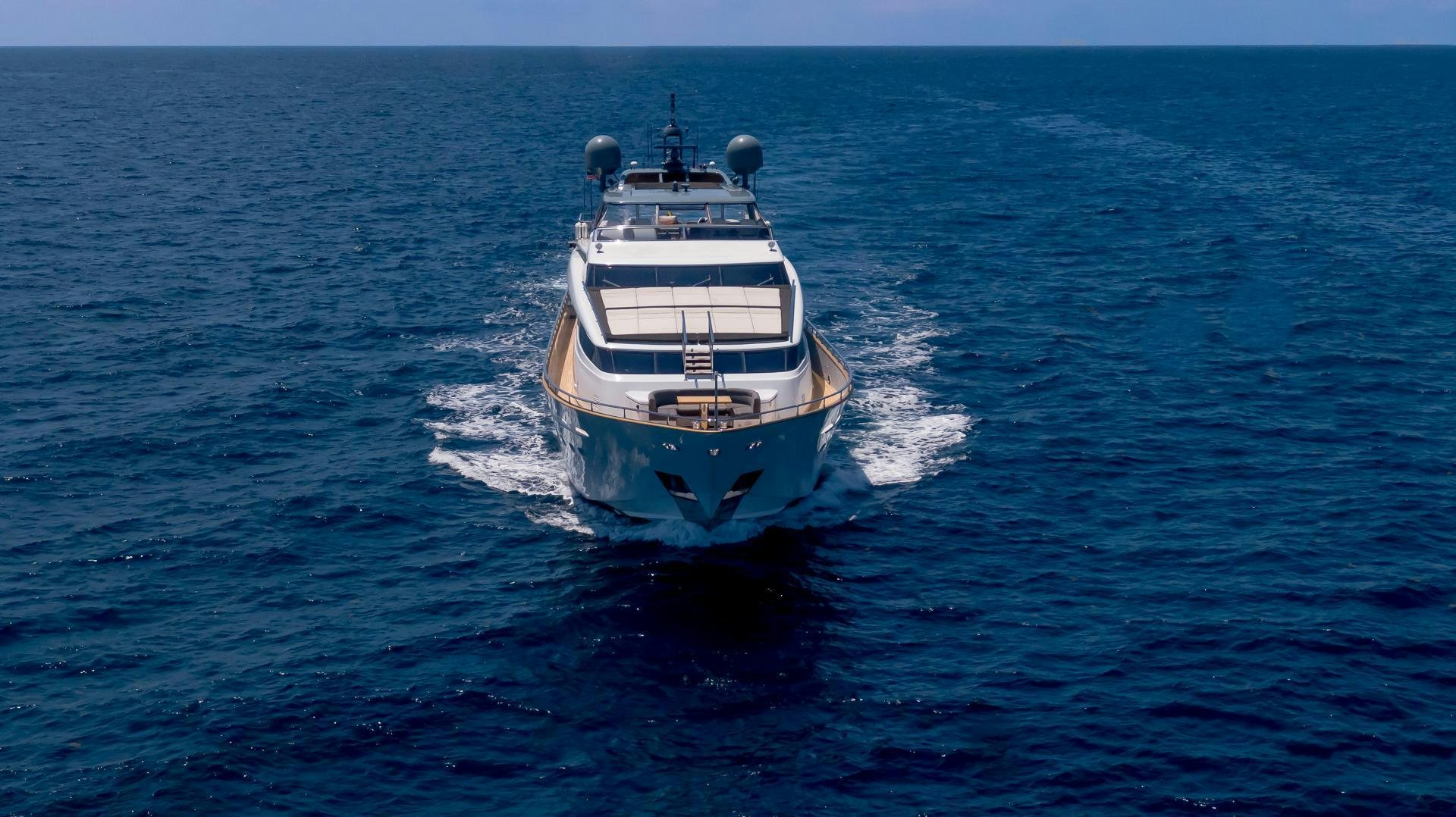 a large white boat in the water aboard BAD ROMANCE IV Yacht for Sale