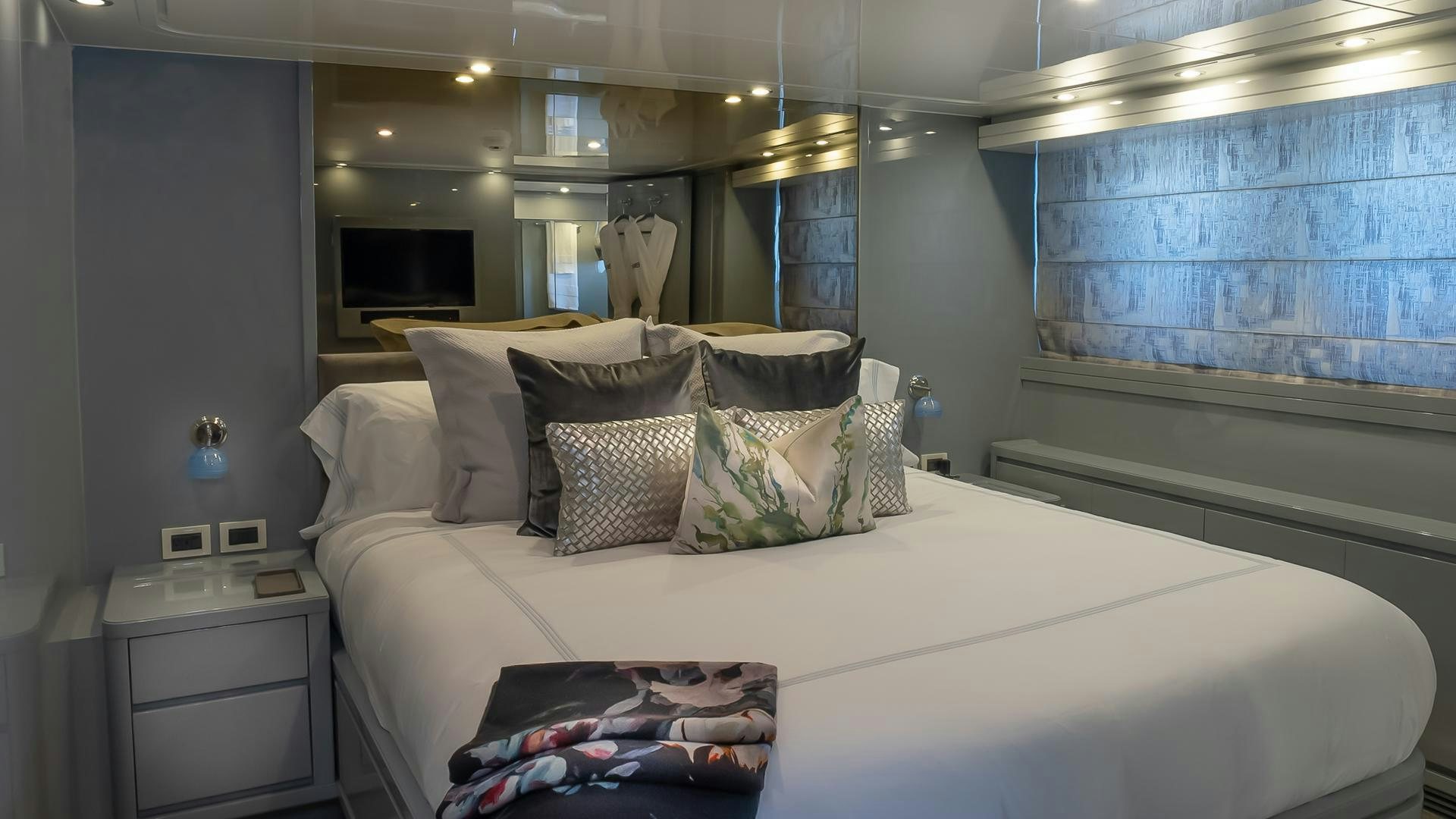 a bed with pillows aboard BAD ROMANCE IV Yacht for Sale