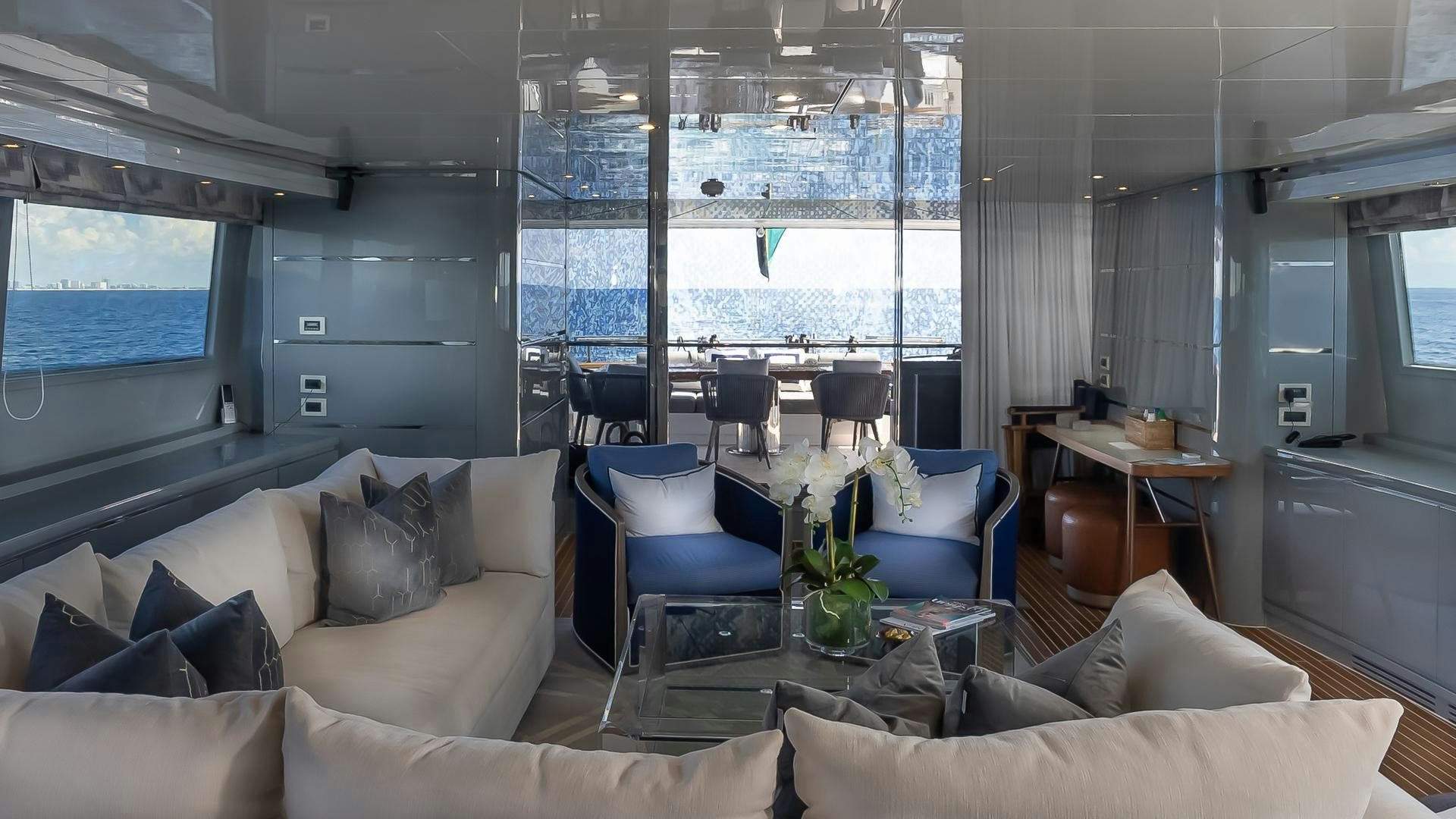 a living room with a large window aboard BAD ROMANCE IV Yacht for Sale