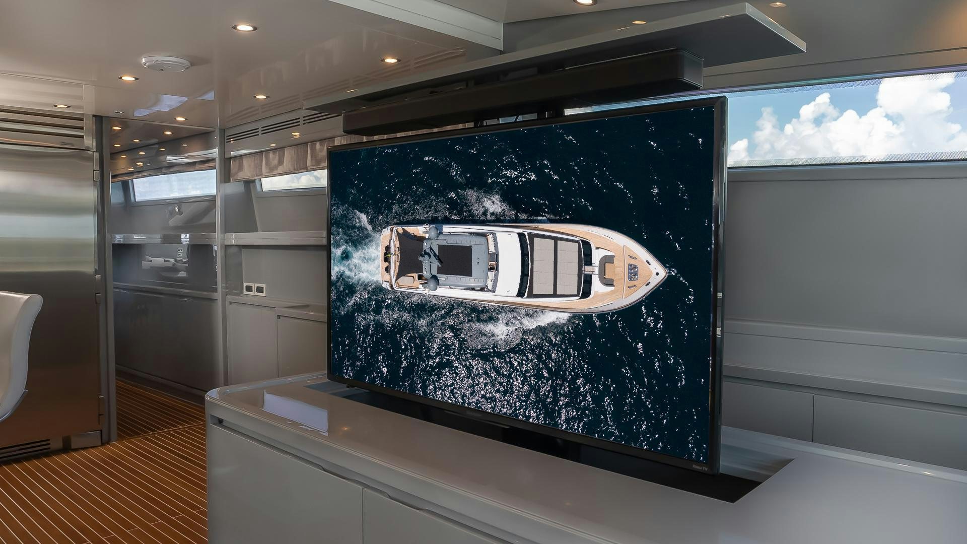a large screen in a room aboard BAD ROMANCE IV Yacht for Sale