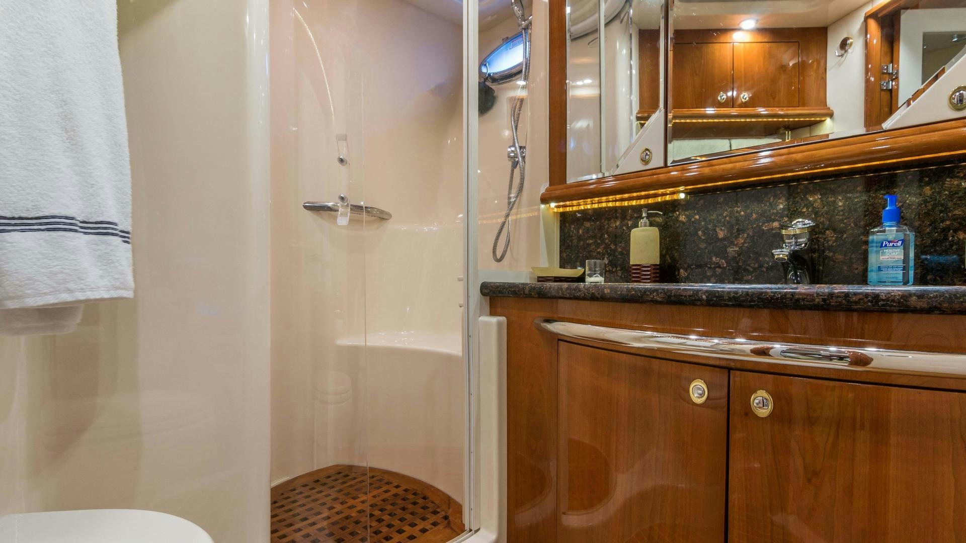 a bathroom with a sink and a mirror aboard XANADU Yacht for Sale