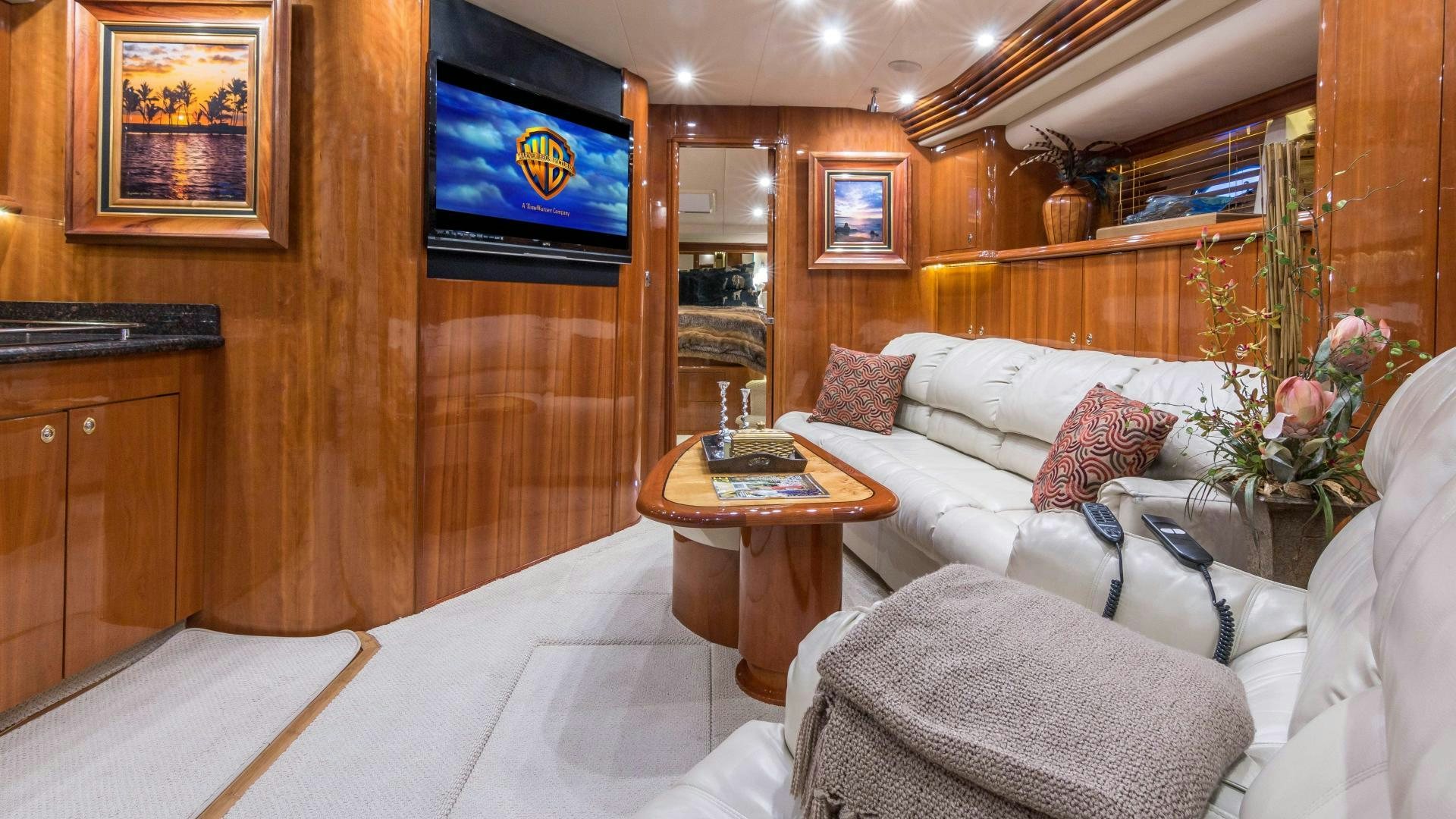 a living room with a couch and a coffee table aboard XANADU Yacht for Sale