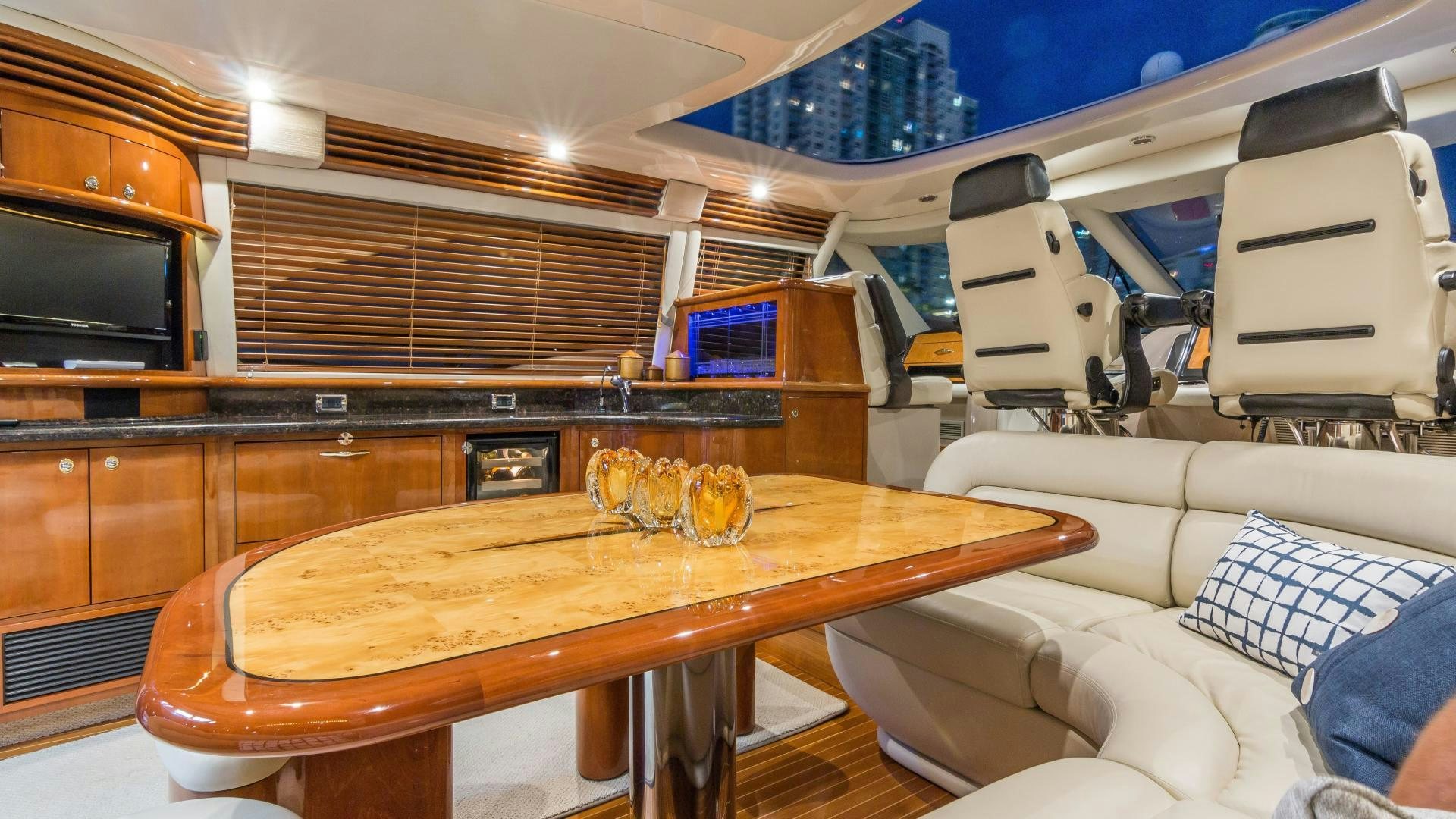 a kitchen with a table and chairs aboard XANADU Yacht for Sale