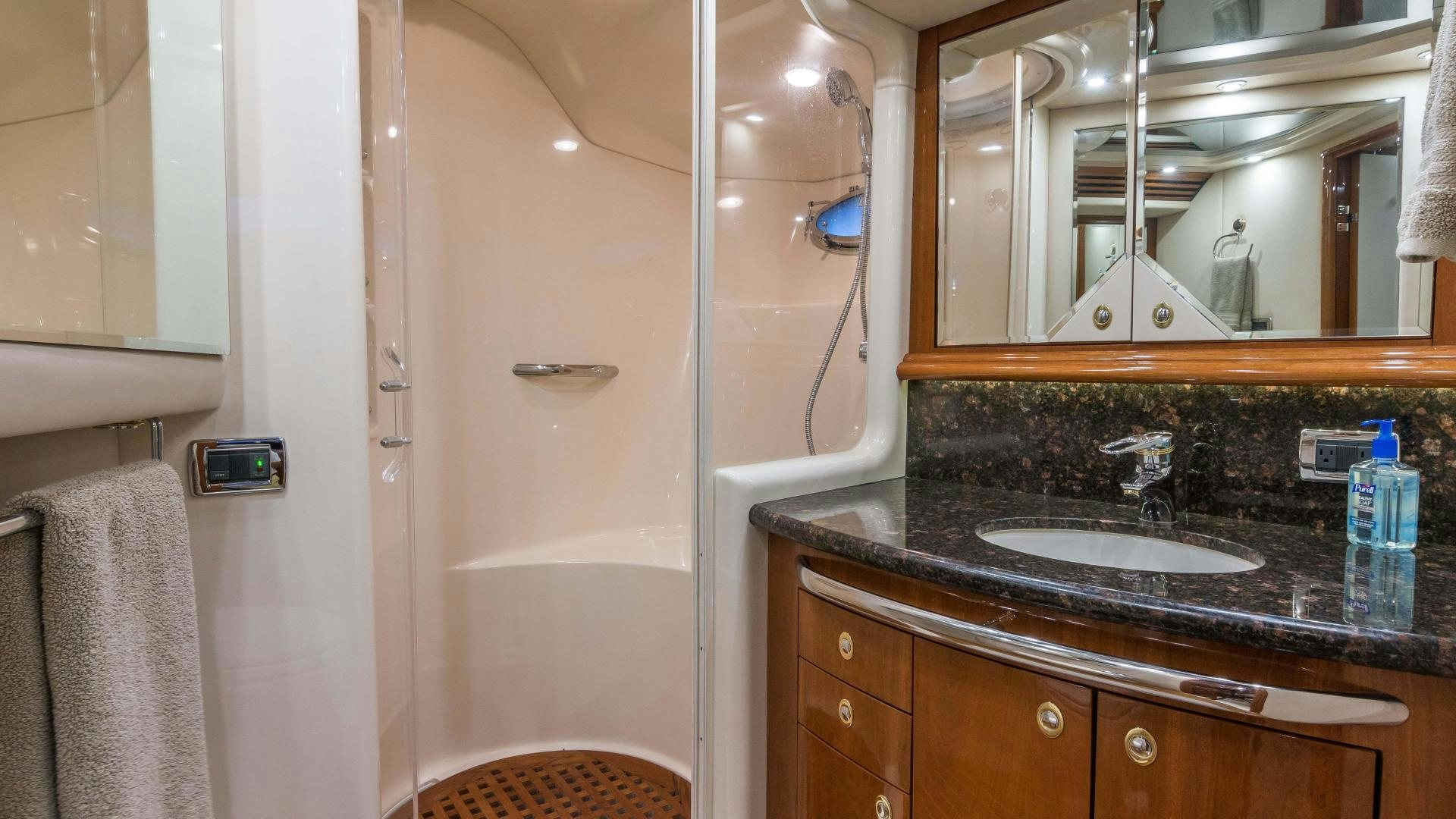 a bathroom with a sink and a mirror aboard XANADU Yacht for Sale