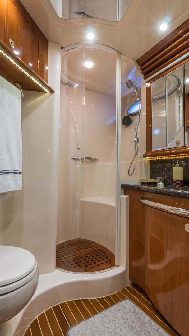 a bathroom with a shower and toilet aboard XANADU Yacht for Sale