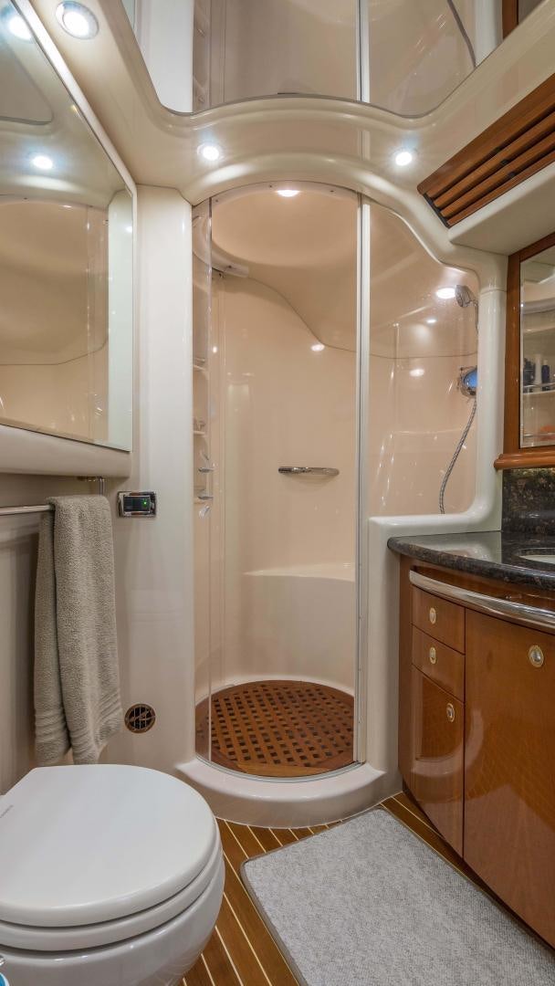 a bathroom with a shower and toilet aboard XANADU Yacht for Sale
