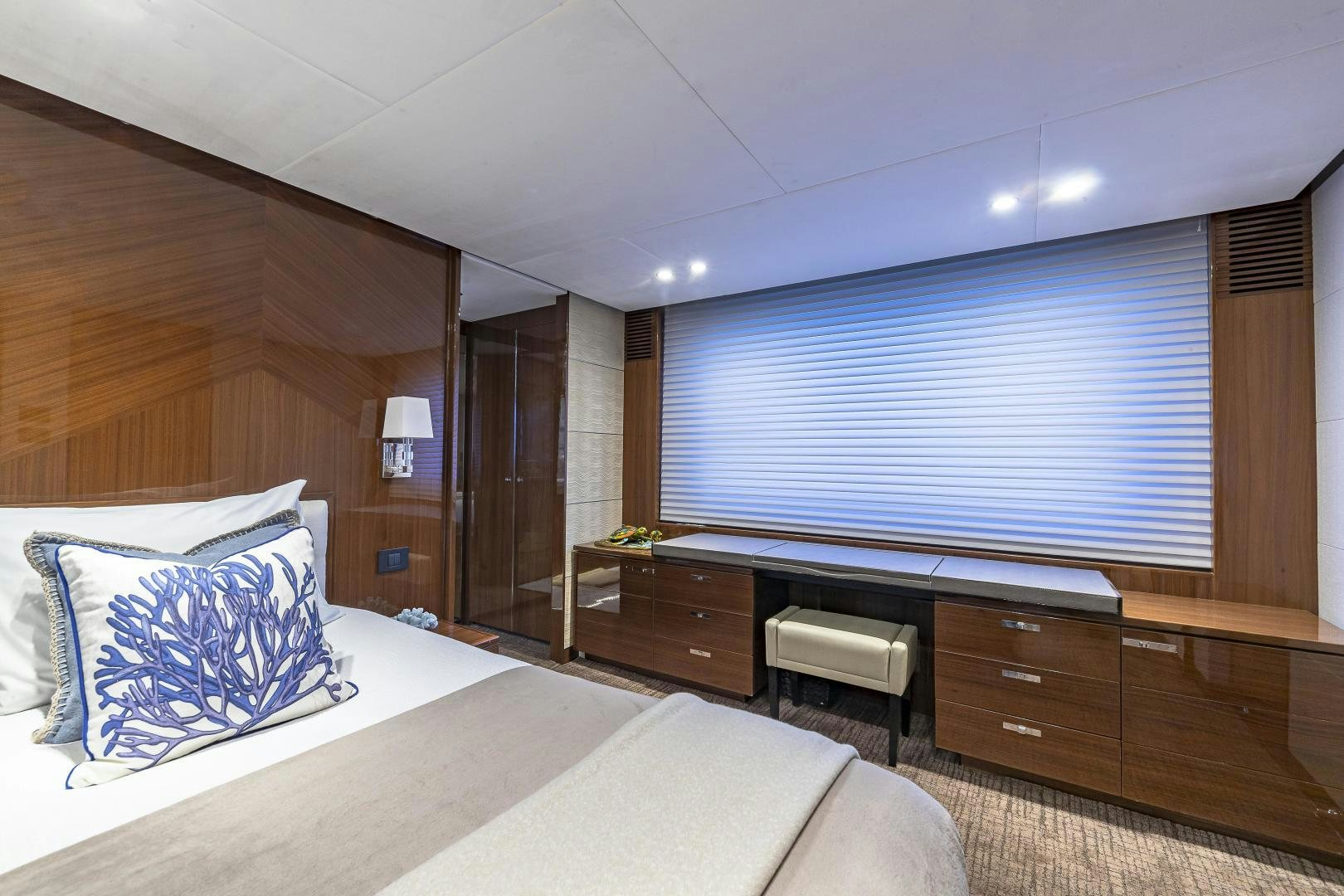 a room with a bed and a large window aboard GOOD LIFE Yacht for Sale