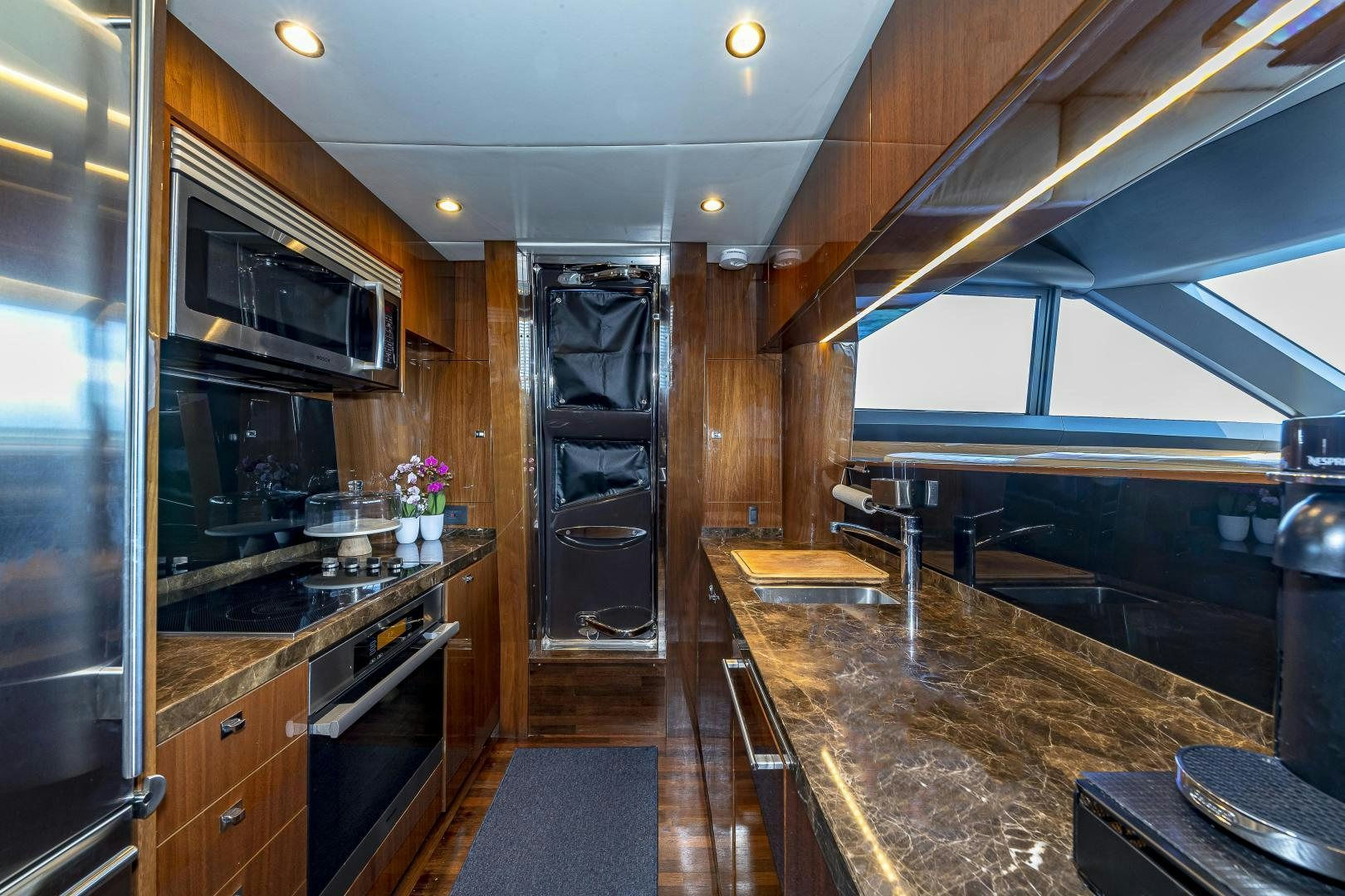 a kitchen with a large island aboard GOOD LIFE Yacht for Sale