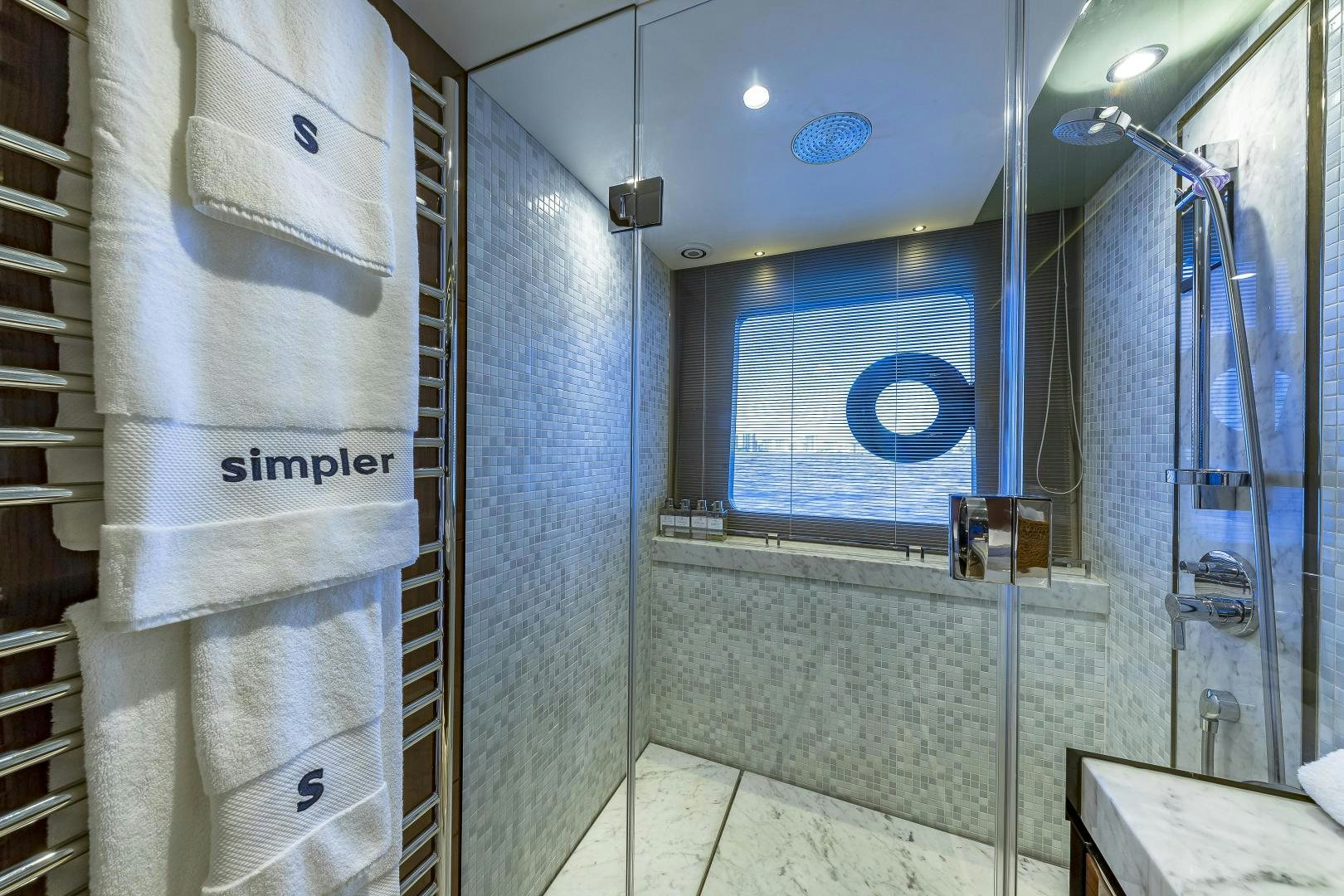 a bathroom with a shower unit and a sink aboard GOOD LIFE Yacht for Sale