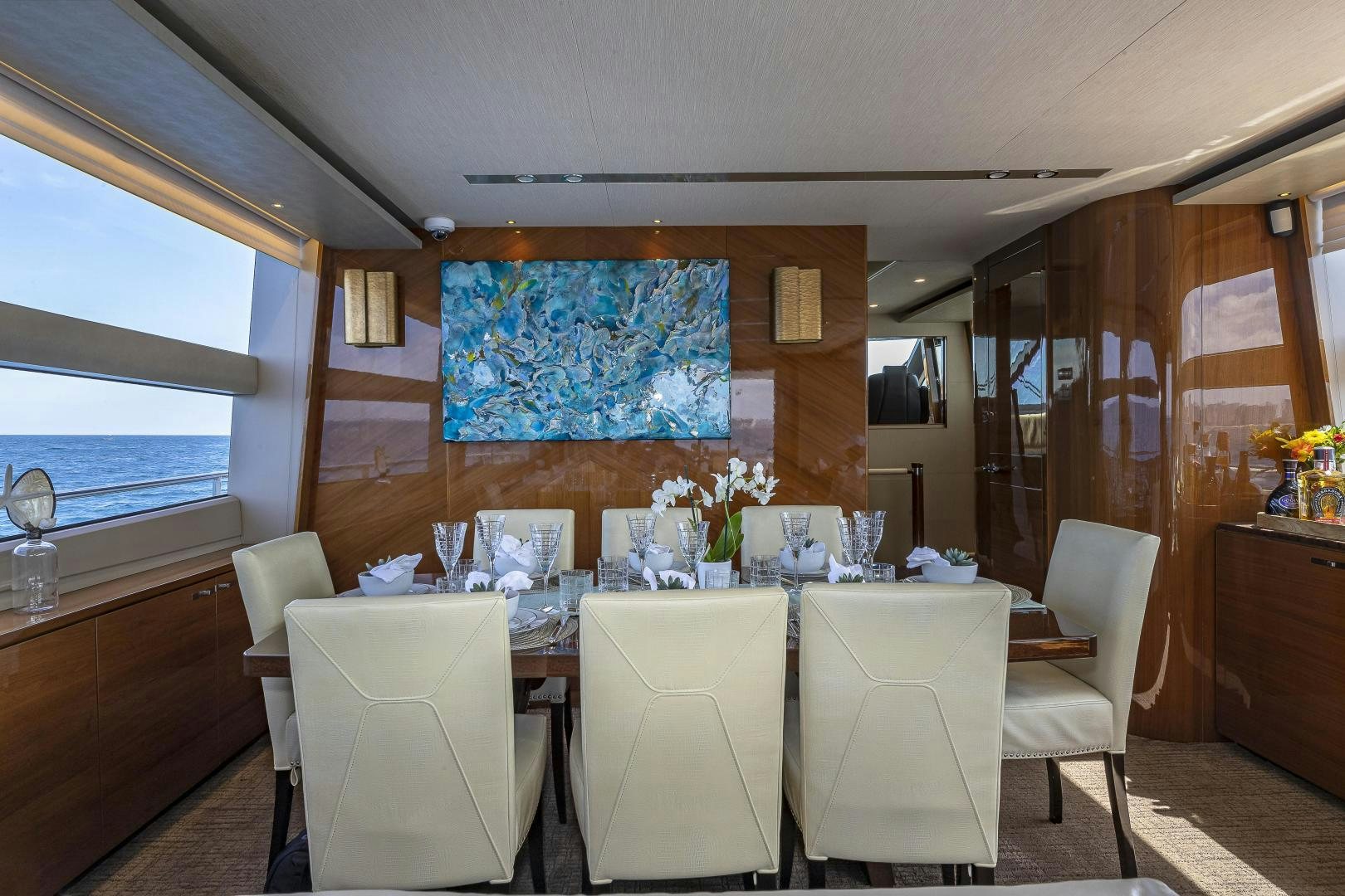 a room with a table and chairs aboard GOOD LIFE Yacht for Sale