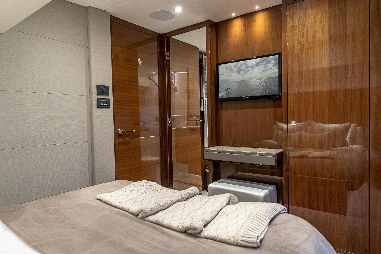 a hotel room with a bed and tv aboard GOOD LIFE Yacht for Sale