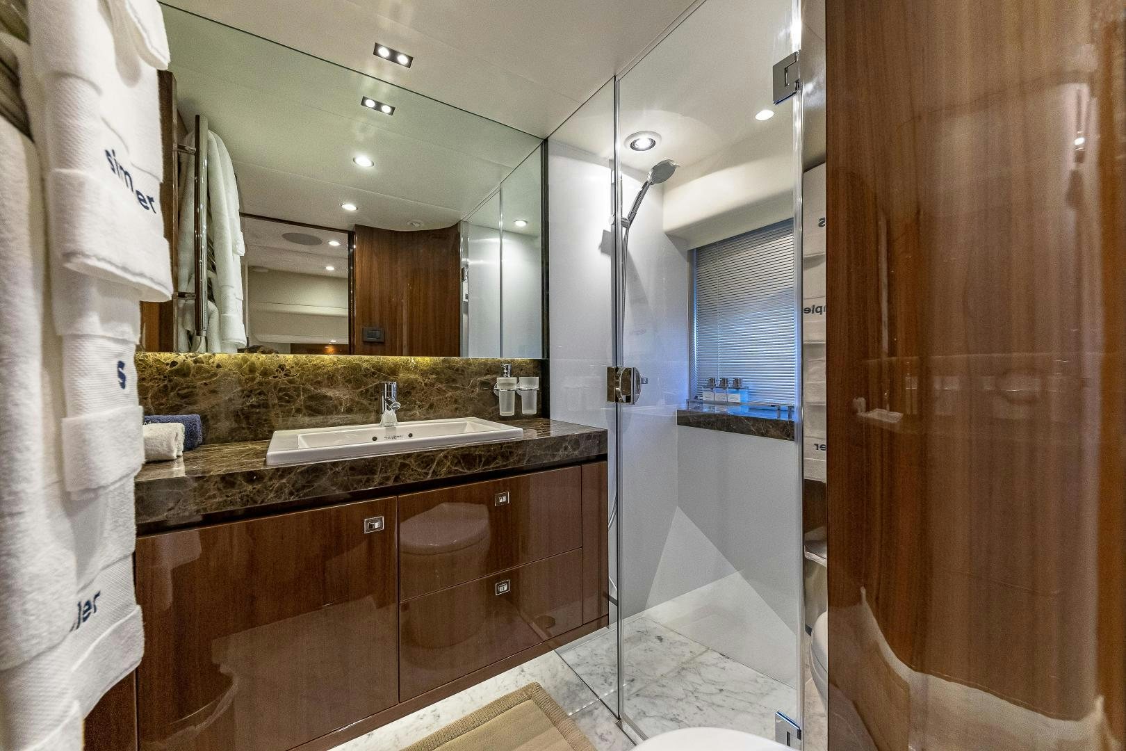 a bathroom with a large mirror aboard GOOD LIFE Yacht for Sale