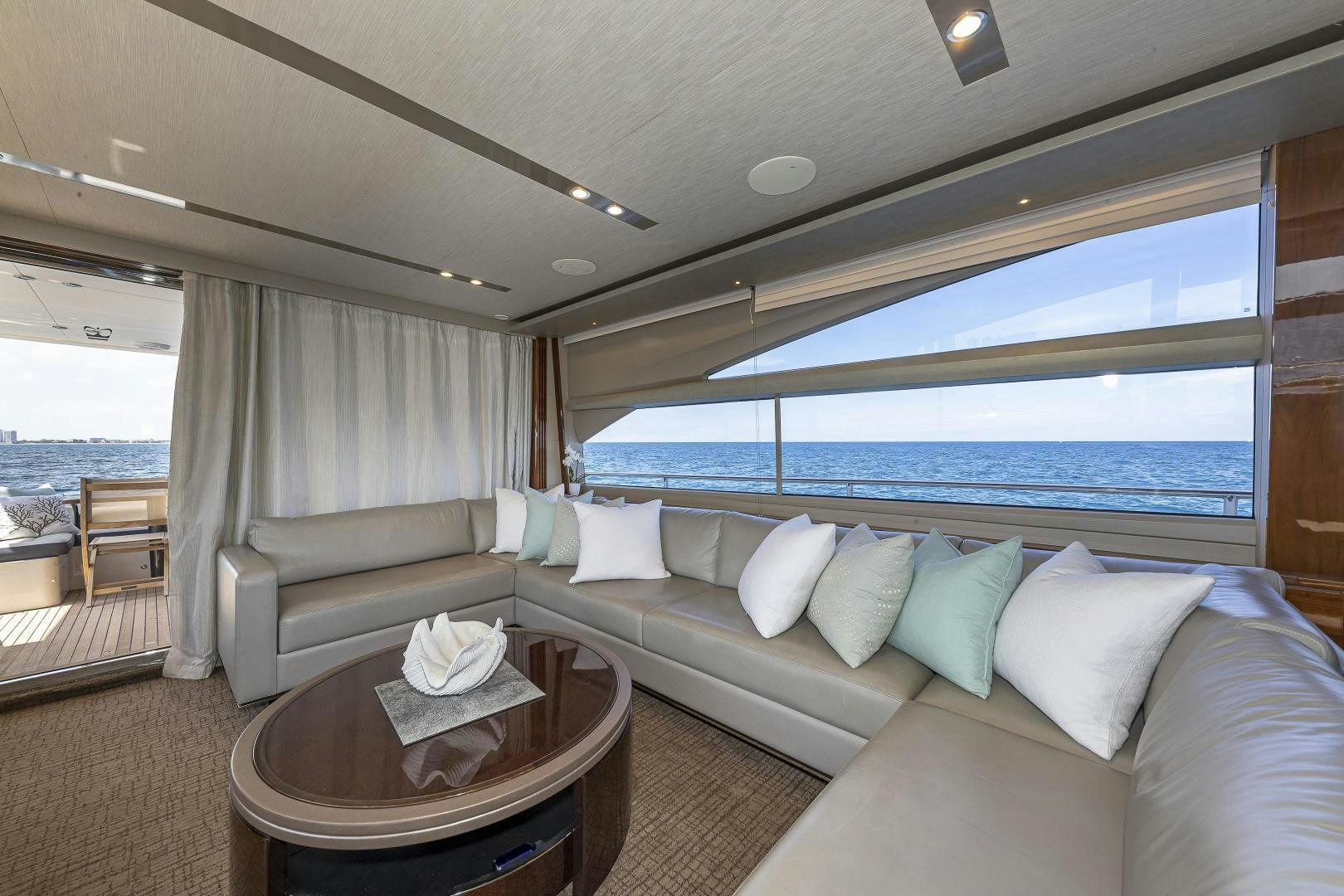 a living room with a large window aboard GOOD LIFE Yacht for Sale