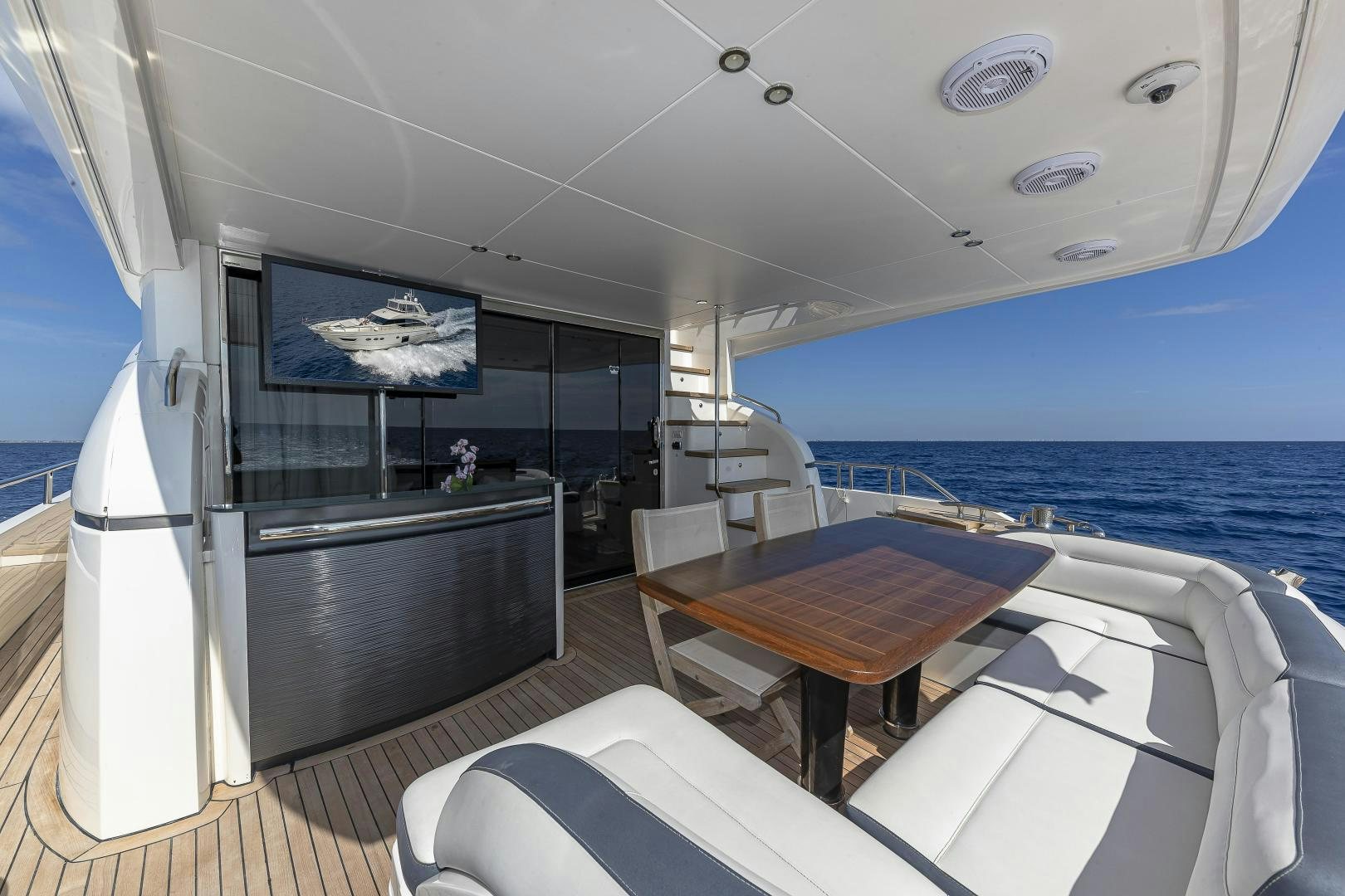 a room with a table and chairs aboard GOOD LIFE Yacht for Sale