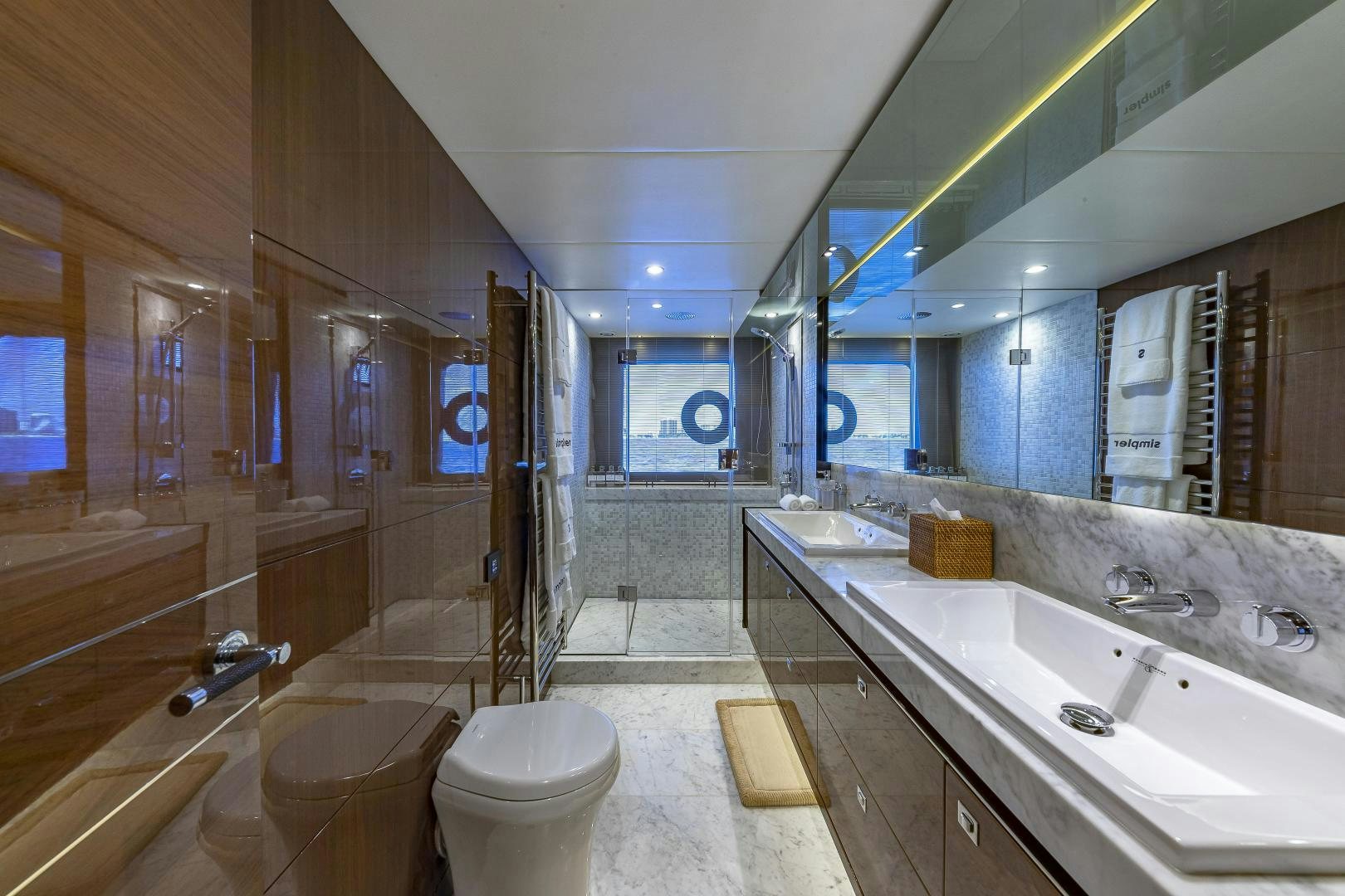 a bathroom with a large mirror aboard GOOD LIFE Yacht for Sale