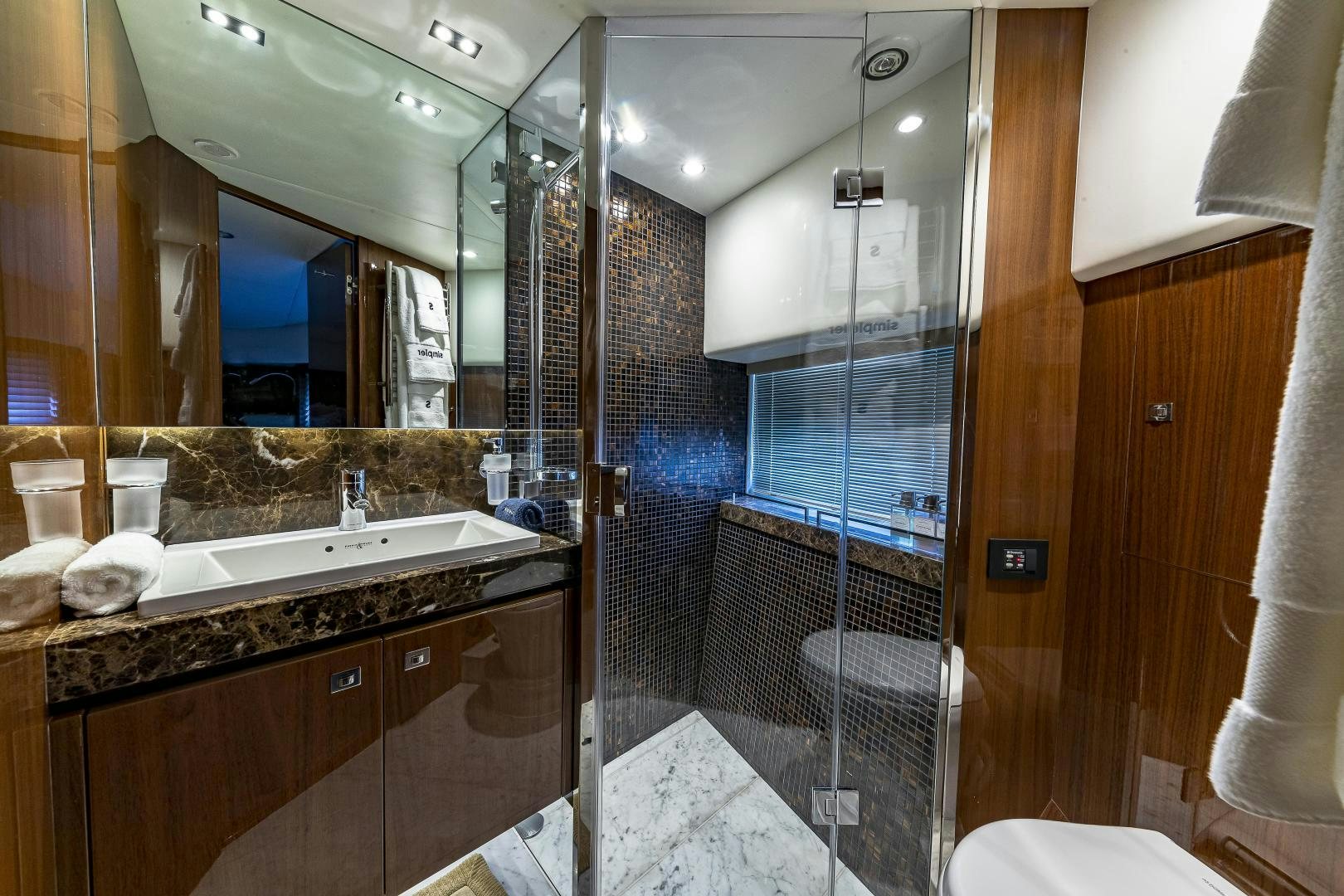 a bathroom with a glass shower aboard GOOD LIFE Yacht for Sale