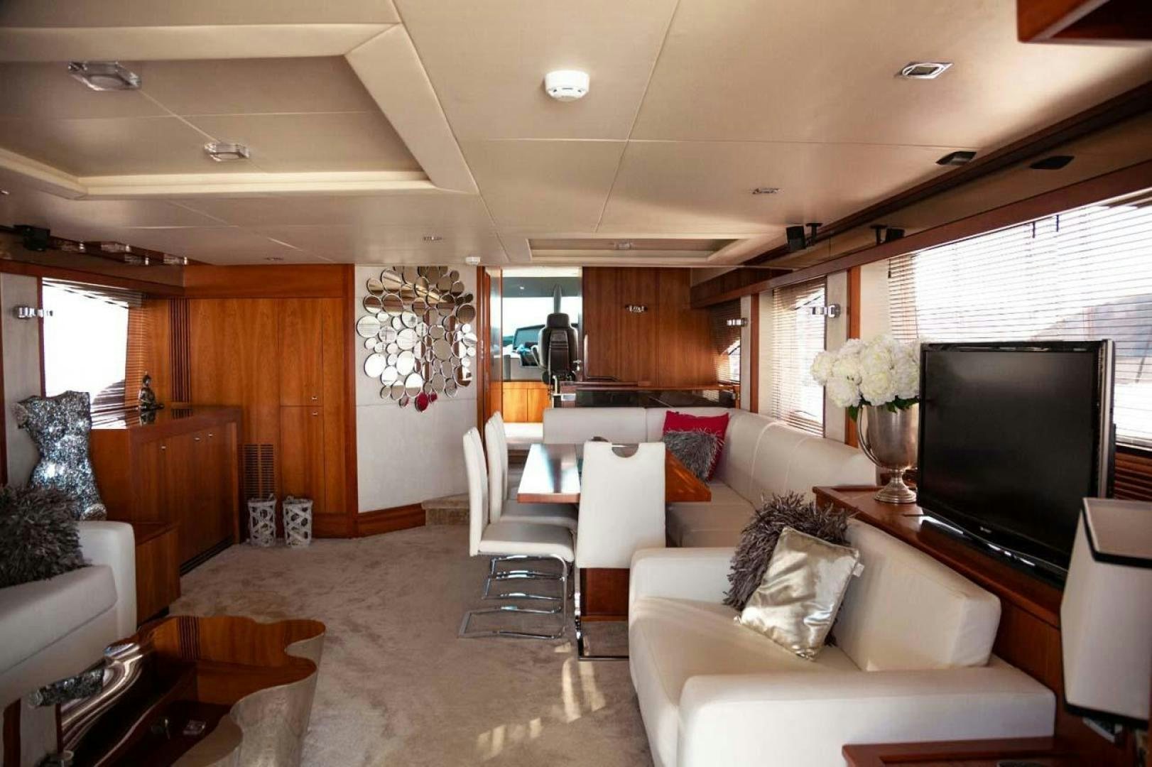 a living room with a large screen aboard LI-JOR Yacht for Sale