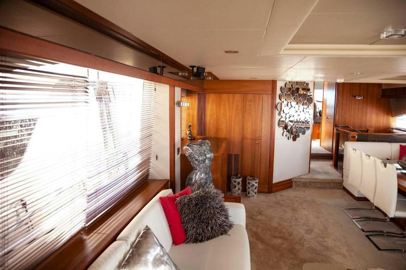 a living room with a large window aboard LI-JOR Yacht for Sale