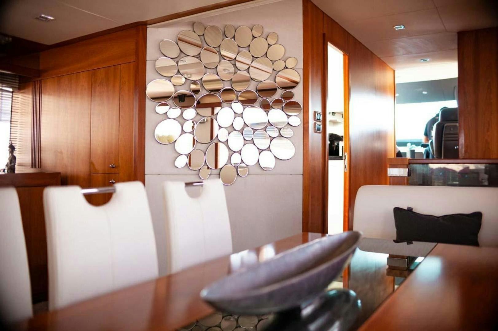 a chandelier over a table aboard LI-JOR Yacht for Sale
