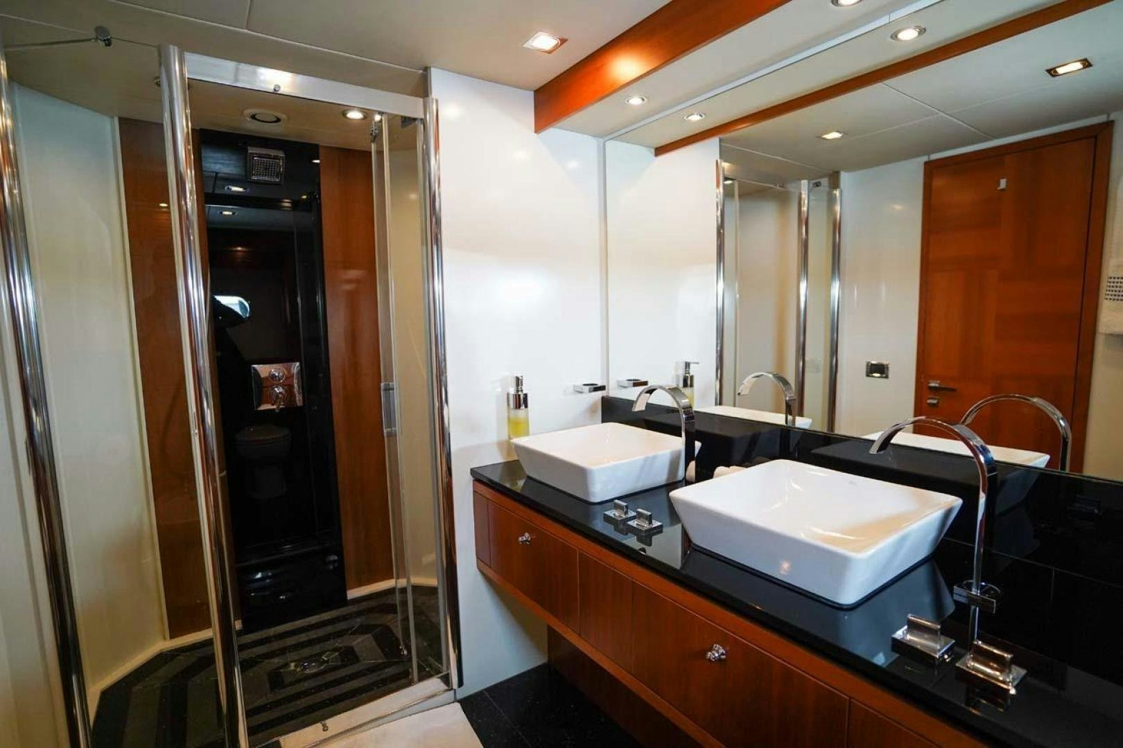 a bathroom with sinks and mirrors aboard LI-JOR Yacht for Sale