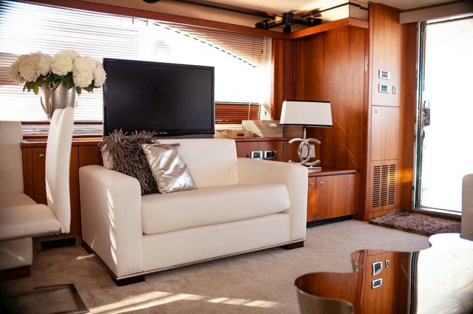 a living room with a white couch aboard LI-JOR Yacht for Sale