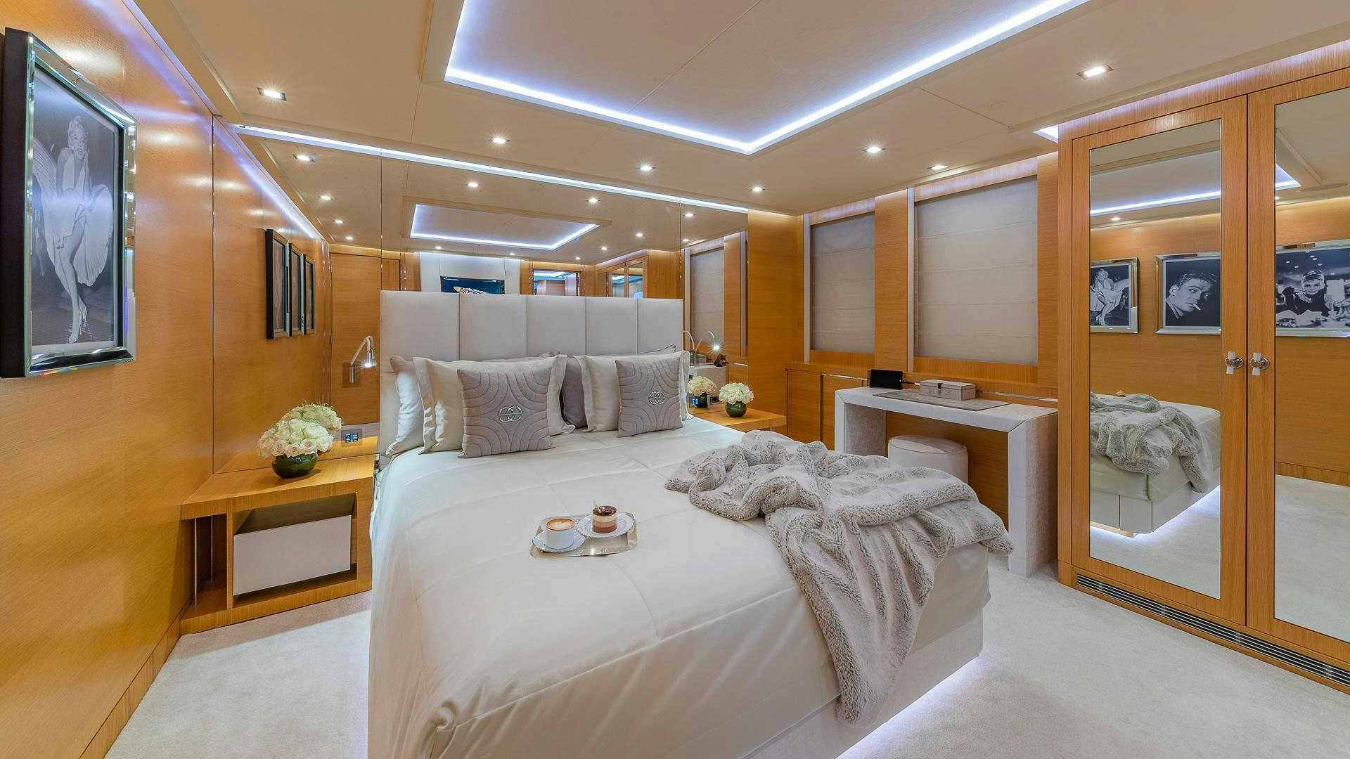 a bedroom with a large bed aboard DB9 Yacht for Sale
