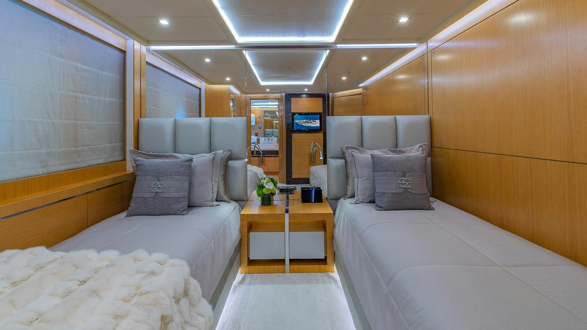 a room with a bed and a table aboard DB9 Yacht for Sale