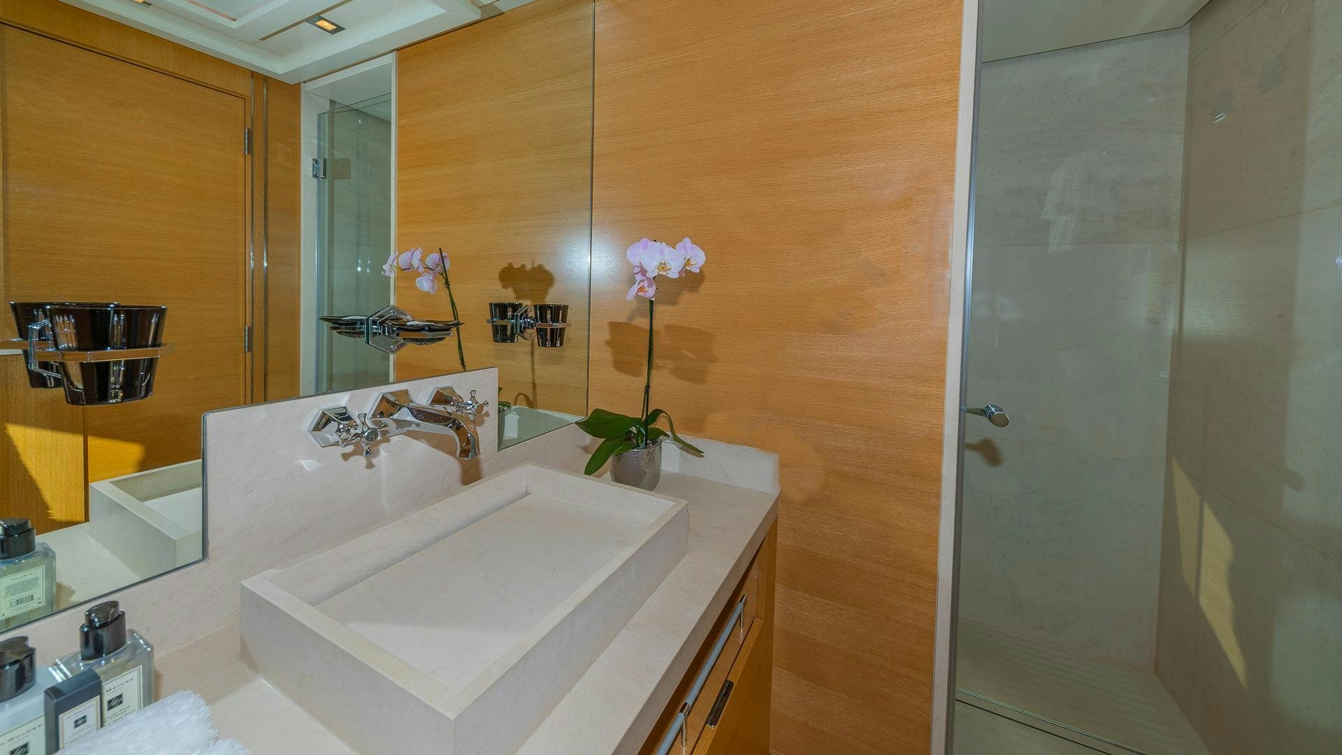 a bathroom with a sink and a mirror aboard DB9 Yacht for Sale