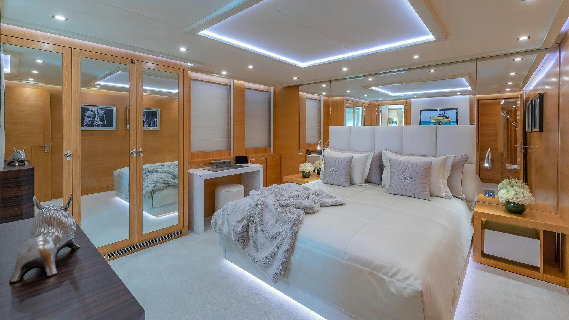 a room with a bed and a table aboard DB9 Yacht for Sale