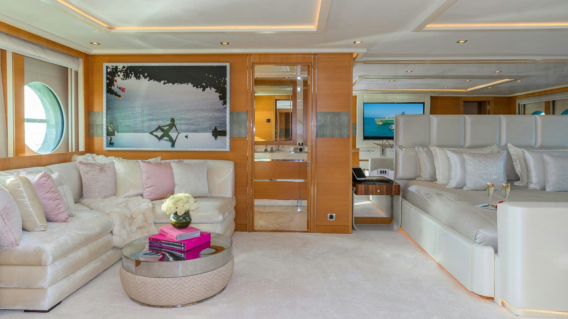 a living room with a couch and a coffee table aboard DB9 Yacht for Sale