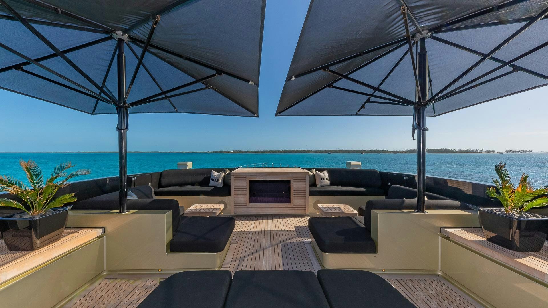 a living room with a large patio aboard DB9 Yacht for Sale