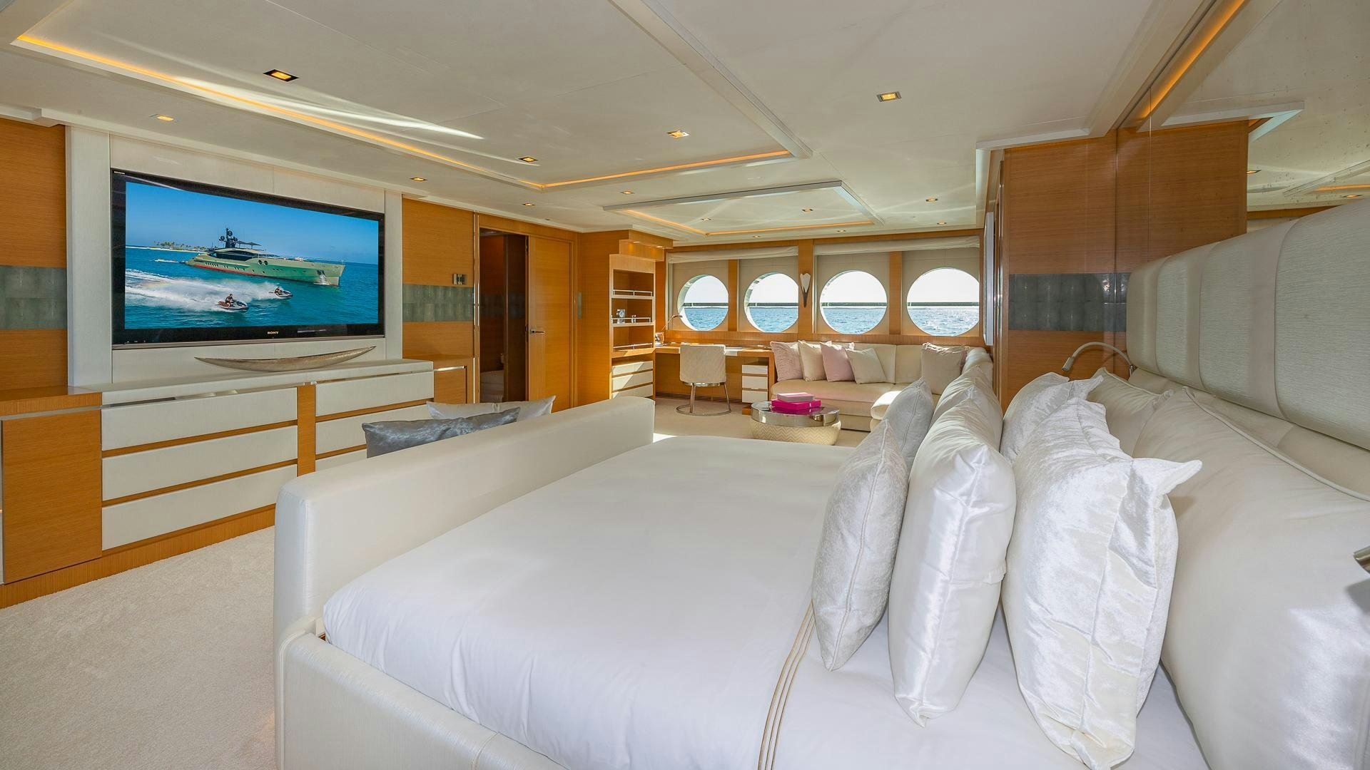 a large living room with a large television aboard DB9 Yacht for Sale