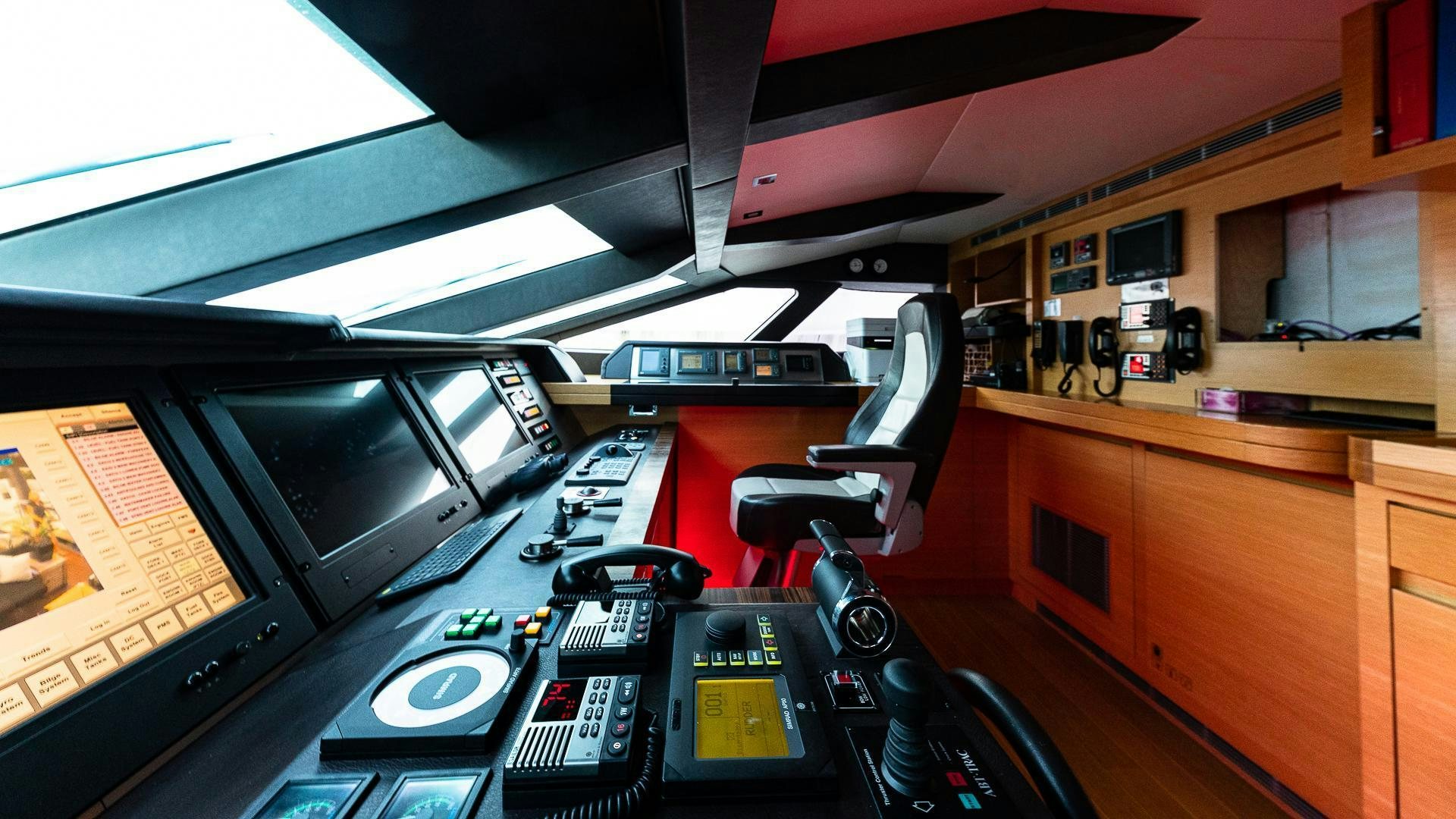 a room with a desk and computer aboard DB9 Yacht for Sale