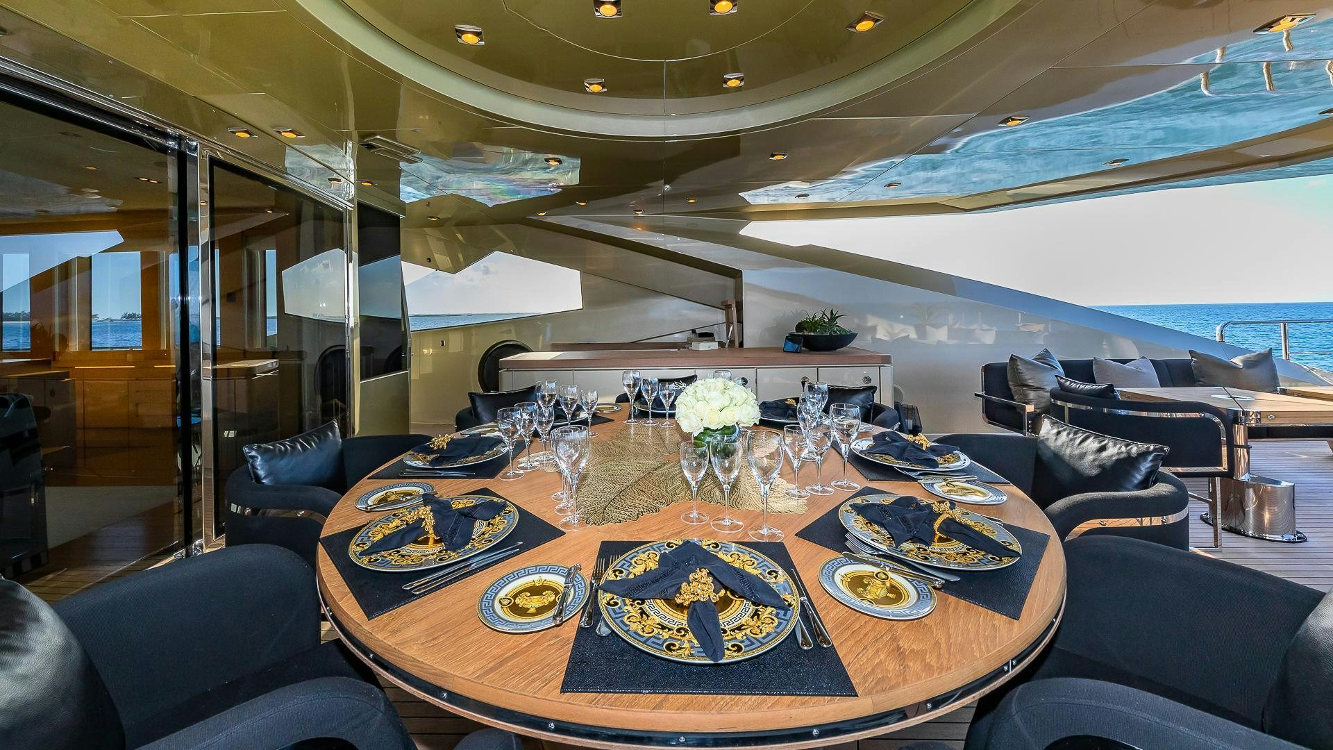 a room with a table and chairs aboard DB9 Yacht for Sale