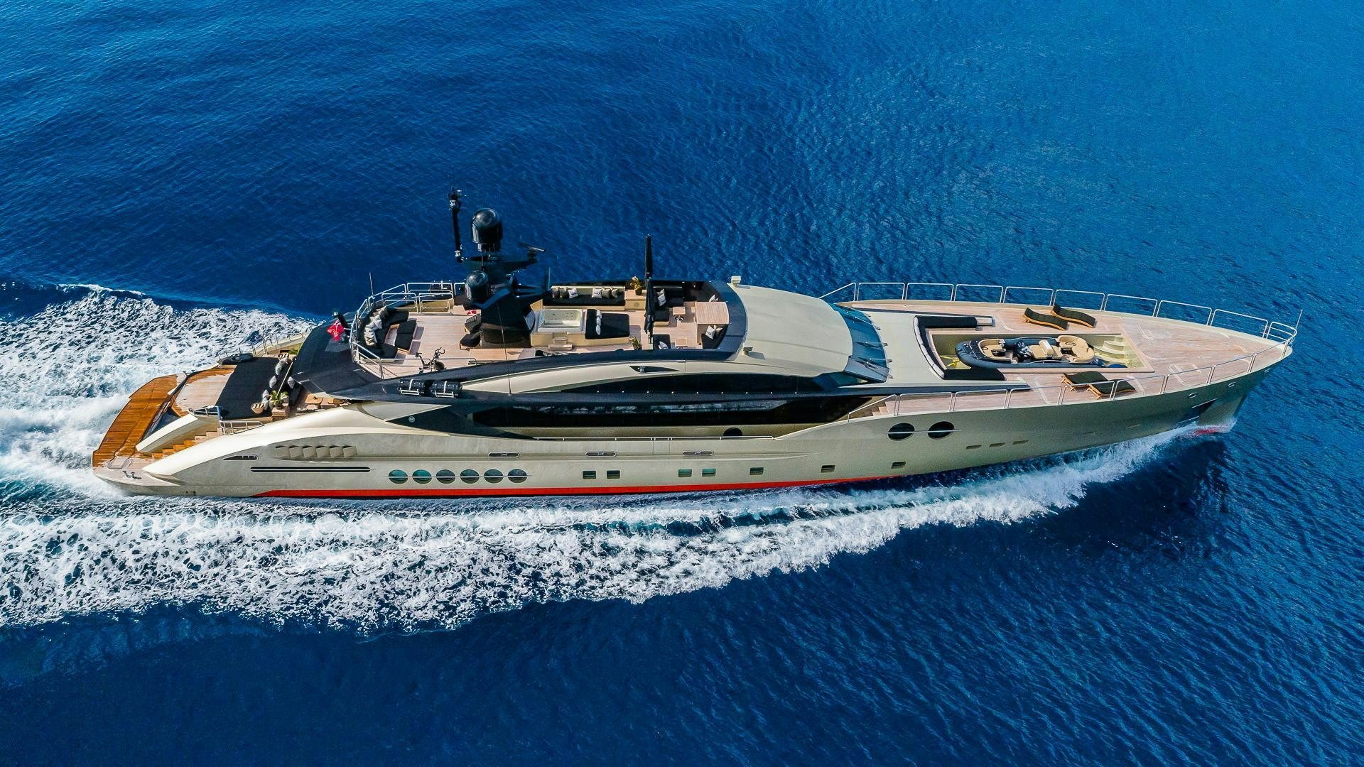 a white and red boat in the water aboard DB9 Yacht for Charter