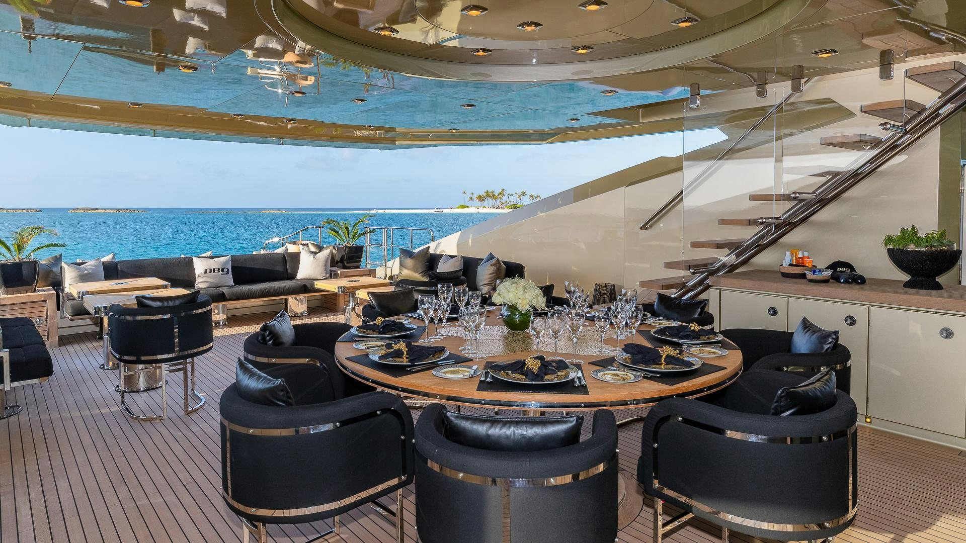 a room with a table chairs and a large window aboard DB9 Yacht for Sale