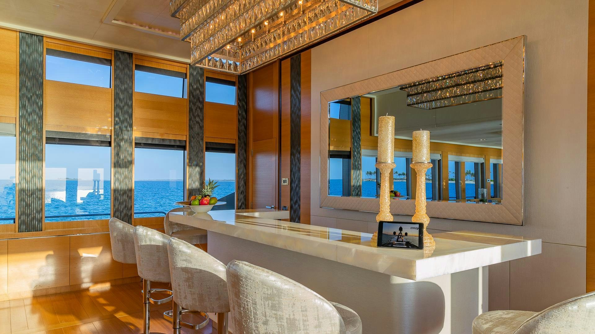 a room with a table and chairs aboard DB9 Yacht for Sale