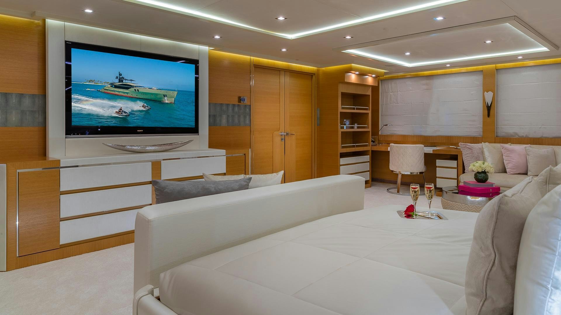 a room with a large screen aboard DB9 Yacht for Sale