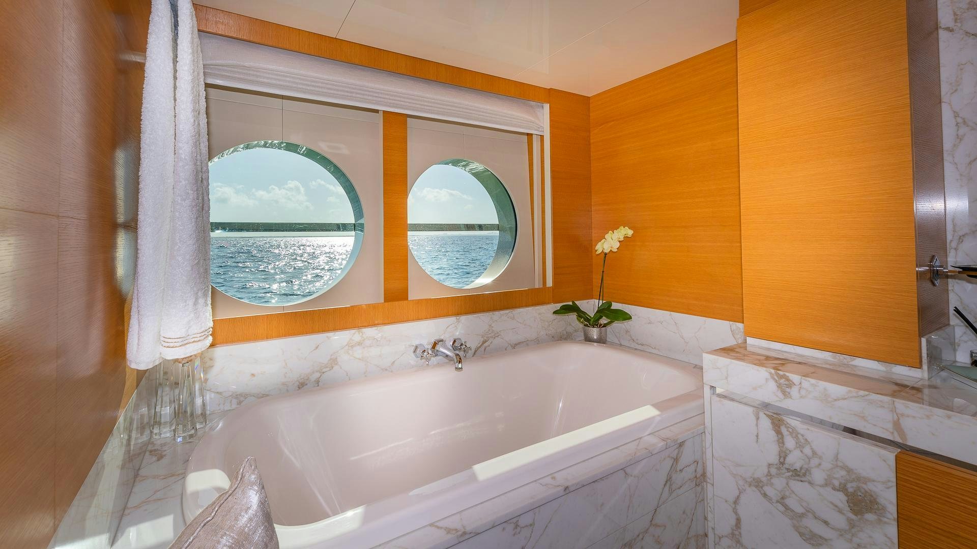a bathtub with a flower in it aboard DB9 Yacht for Sale