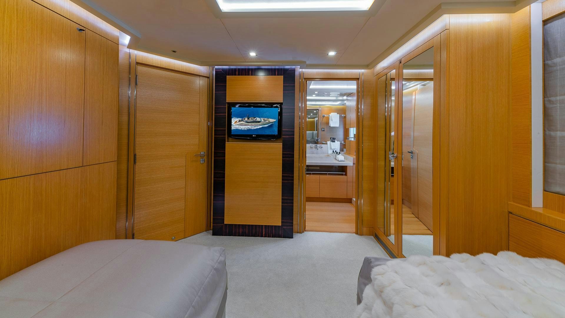 a room with a bed and a desk aboard DB9 Yacht for Sale